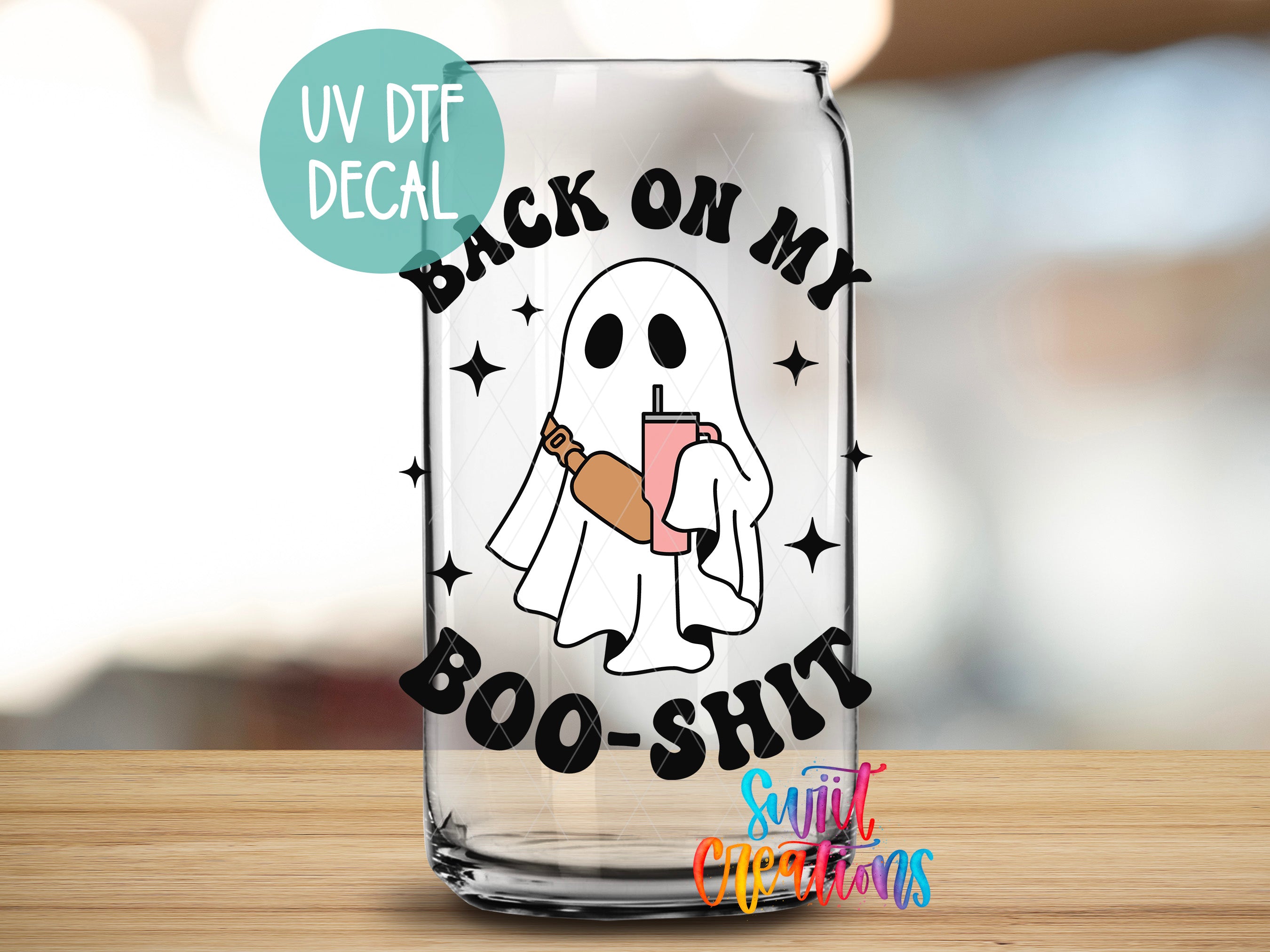 a glass with a ghost holding a drink