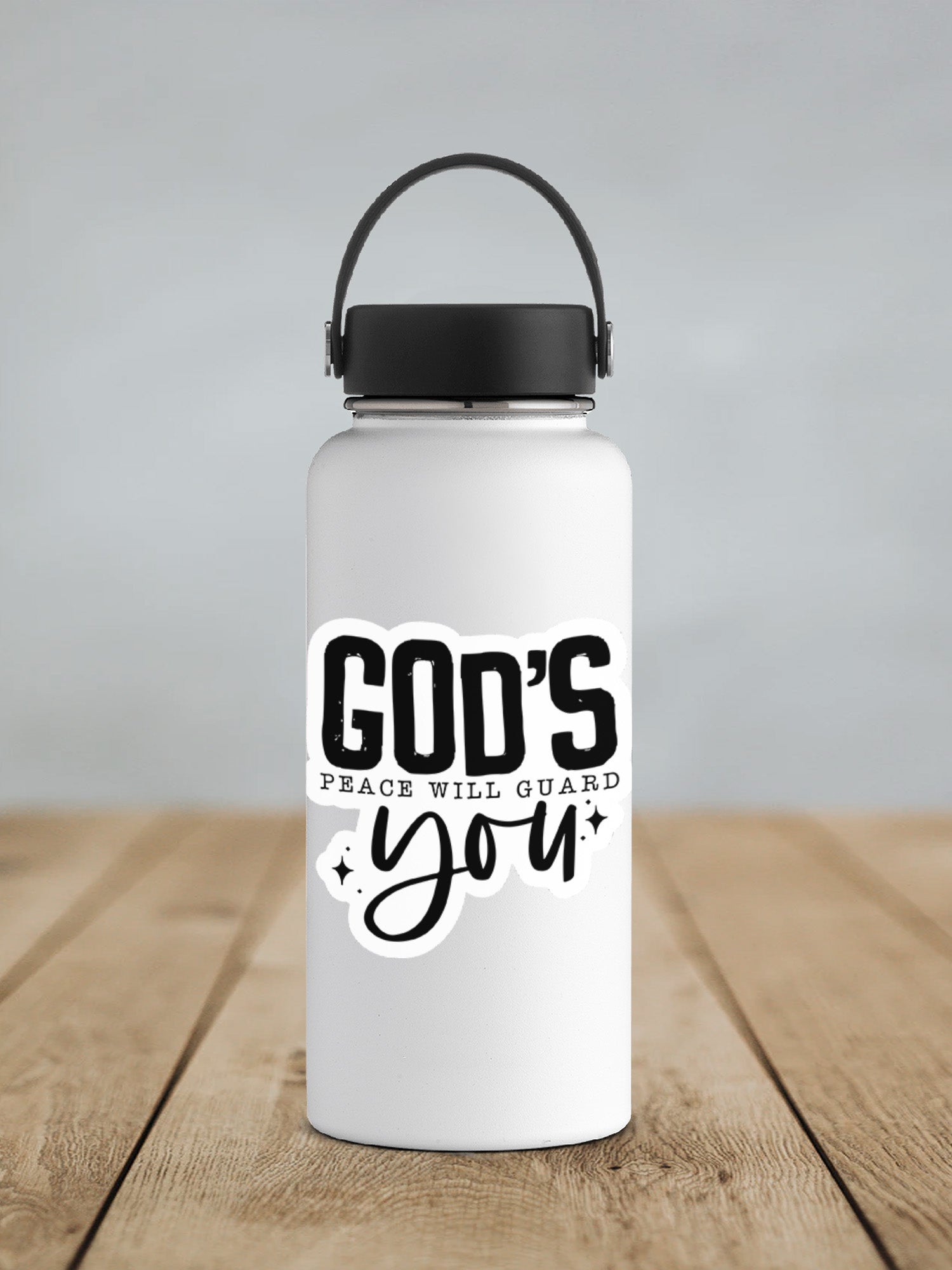 a white water bottle sitting on top of a wooden table