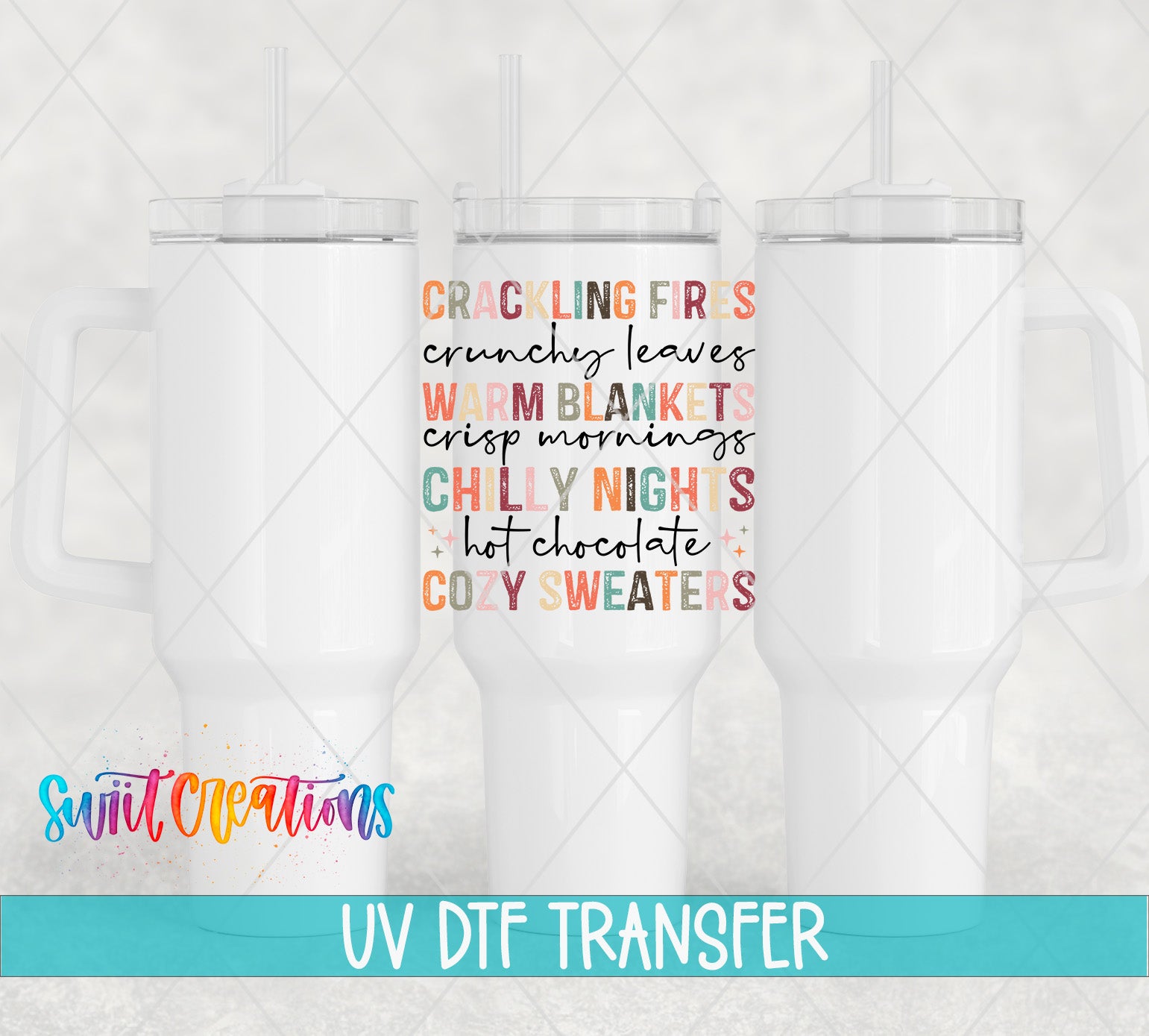 three white tumblers with colorful text printed on them, including phrases like "Crackling Fires", "Crunchy Leaves", "Warm Blankets", "Crisp Mornings", "Chilly Night", "Hot Chocolate", and "Cozy Sweaters".