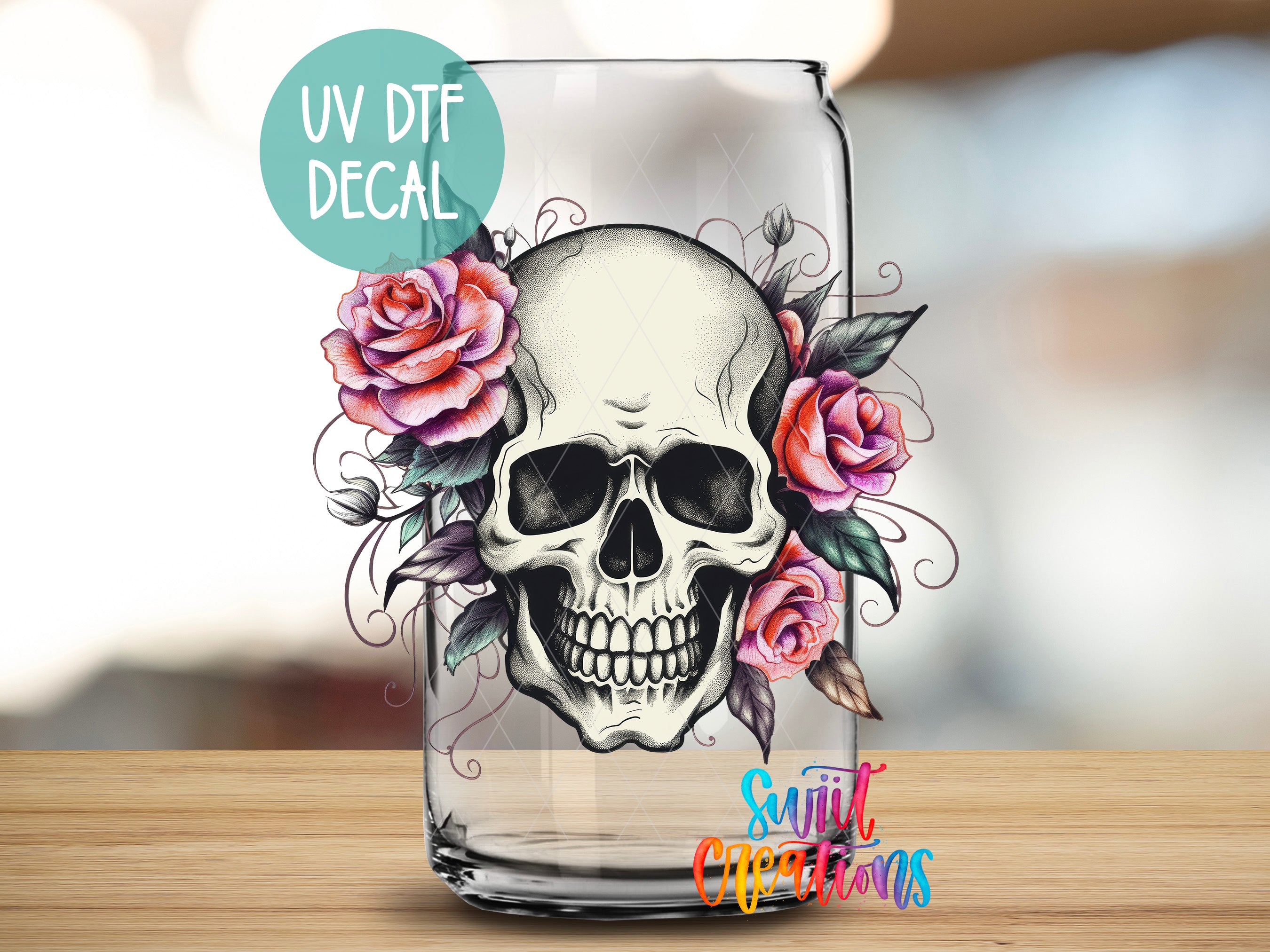 a glass with a skull and flowers painted on it