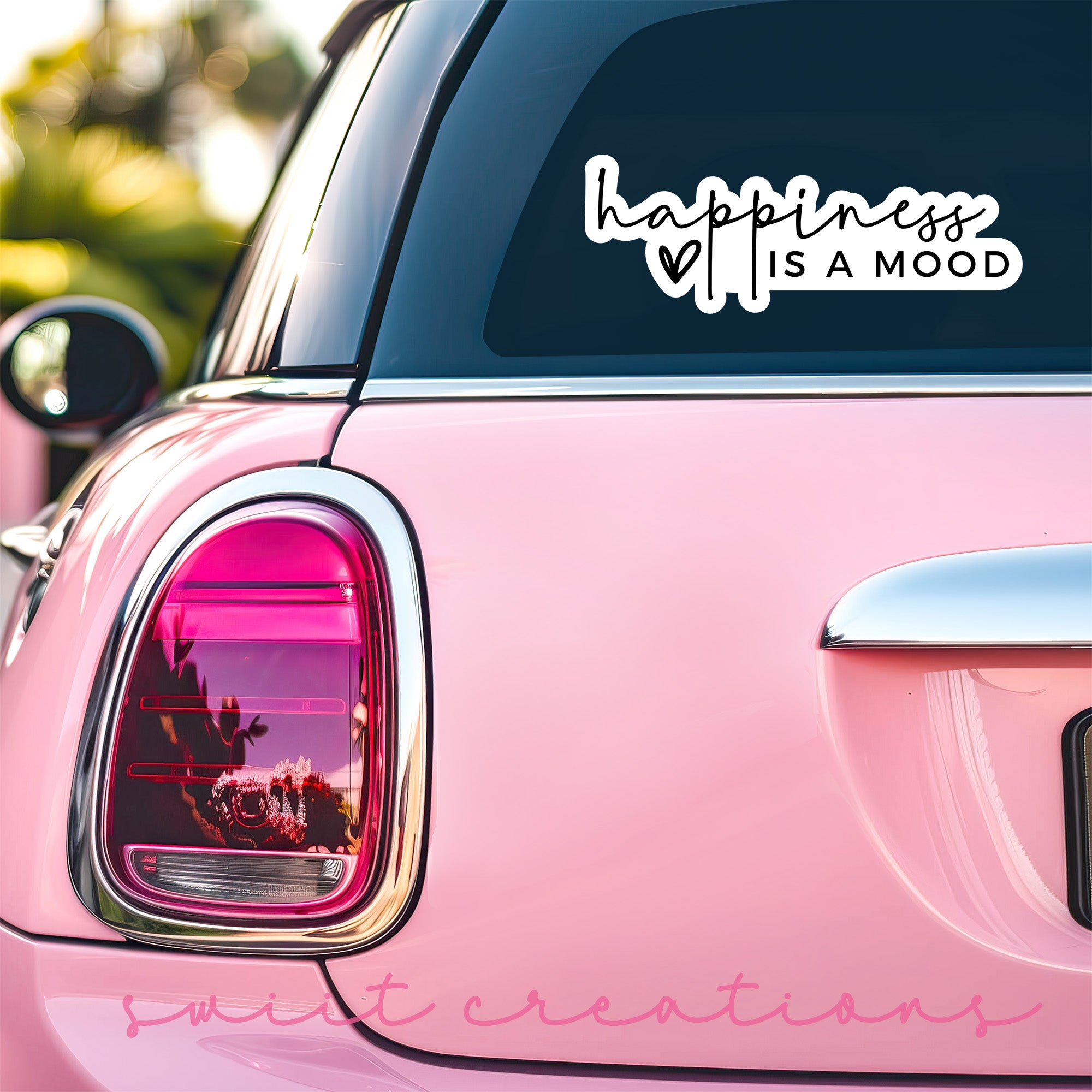 a pink car with a sticker that says happiness is a mood