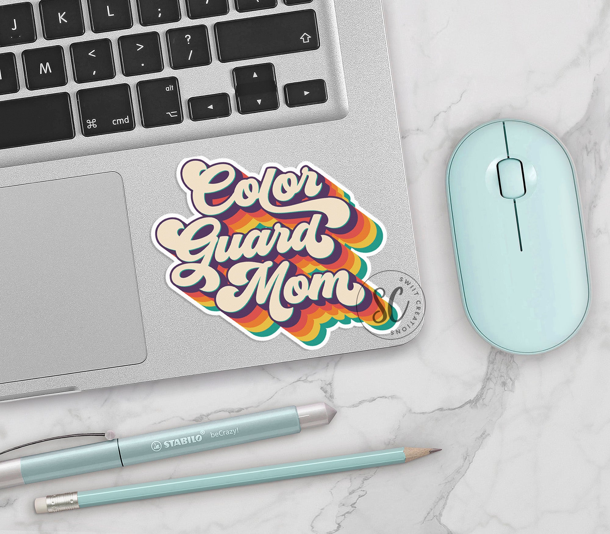 a laptop computer sitting on top of a white table