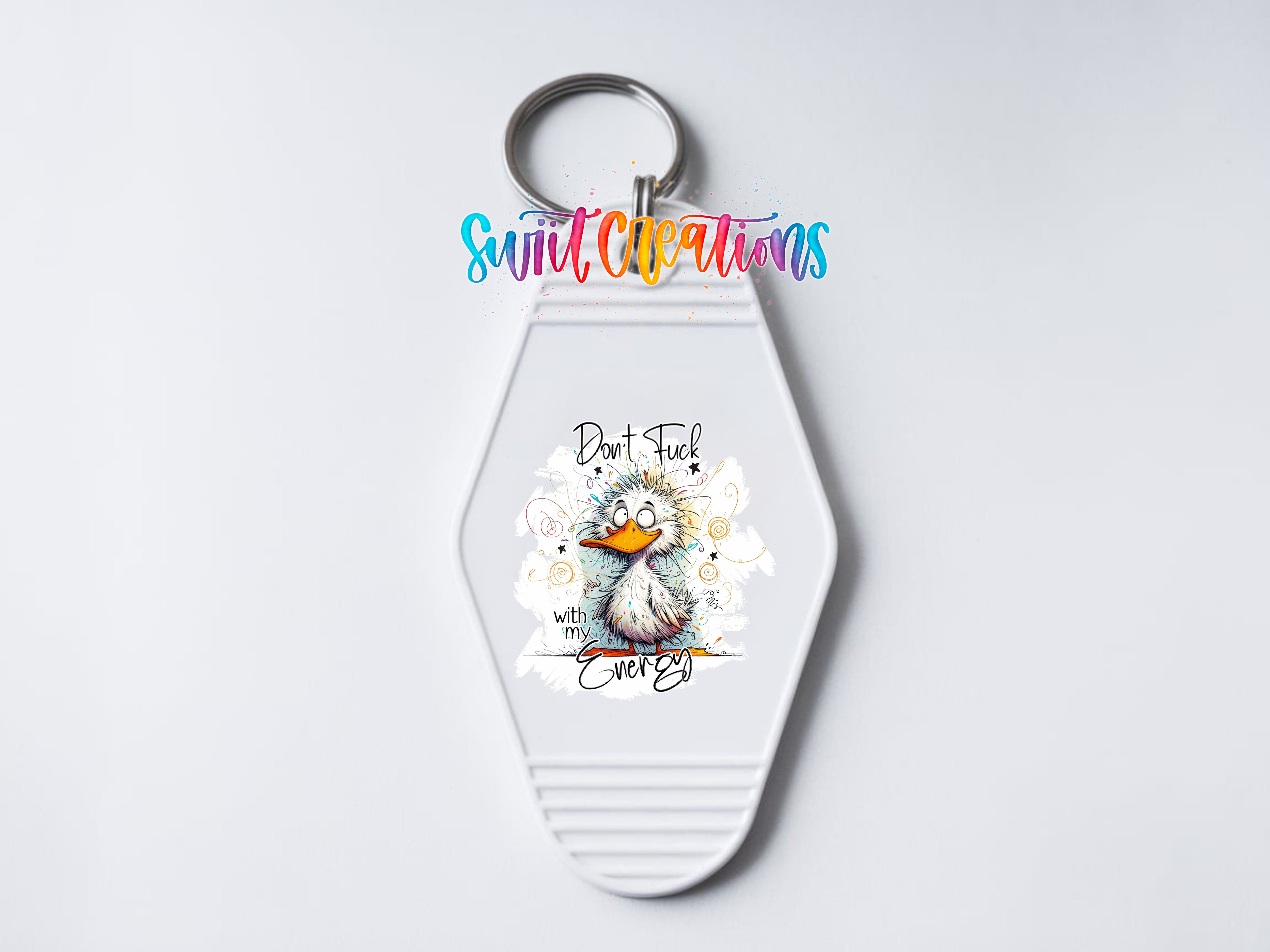 A keychain with a cartoon duck and the text "Don't F**k Everything" printed on it.