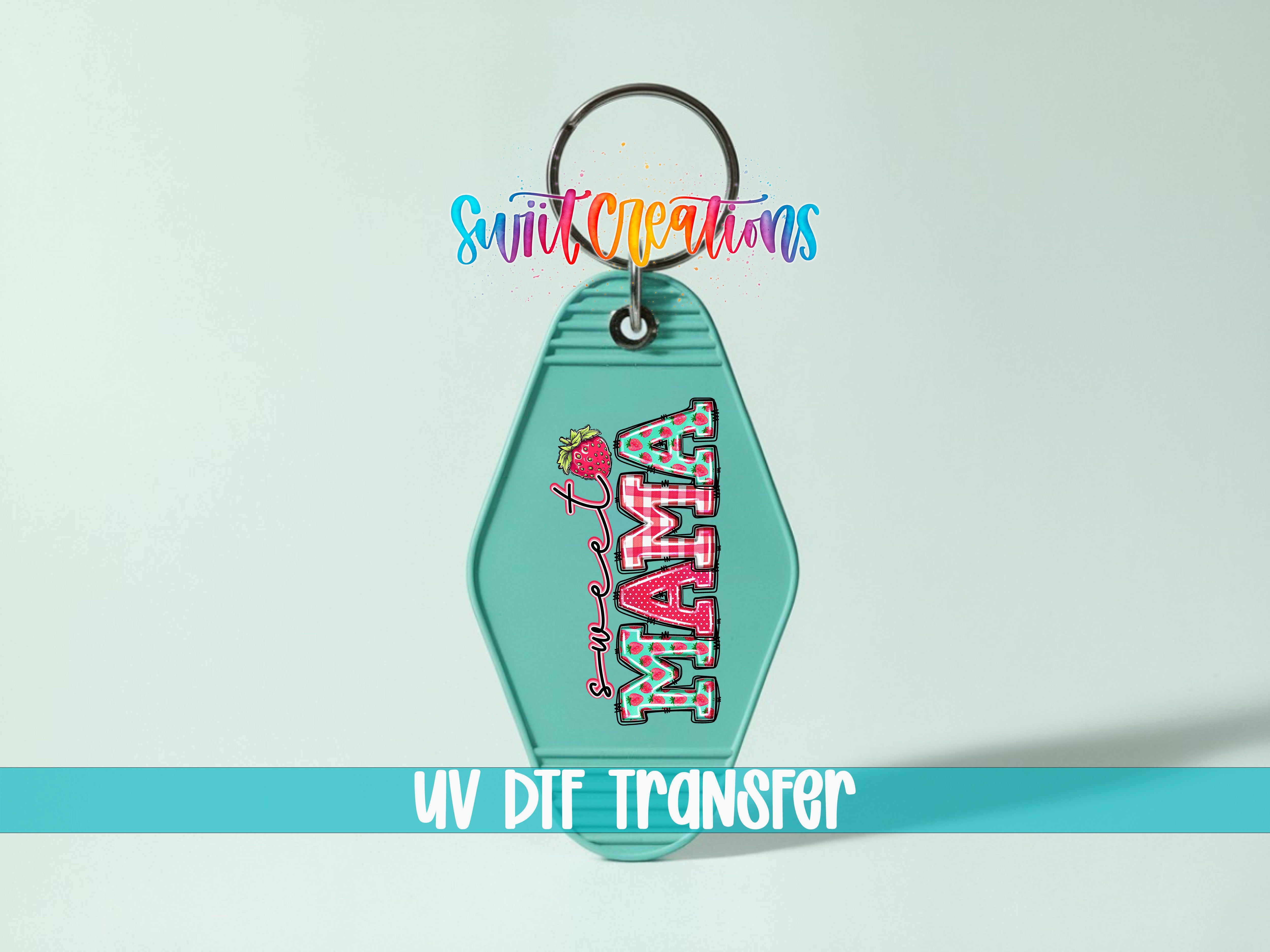 A keychain with the word "MAMA" printed on it, along with a strawberry graphic. The keychain is set against a light blue background, and there is text at the bottom of the image that reads "UV DIF TRANSFER".