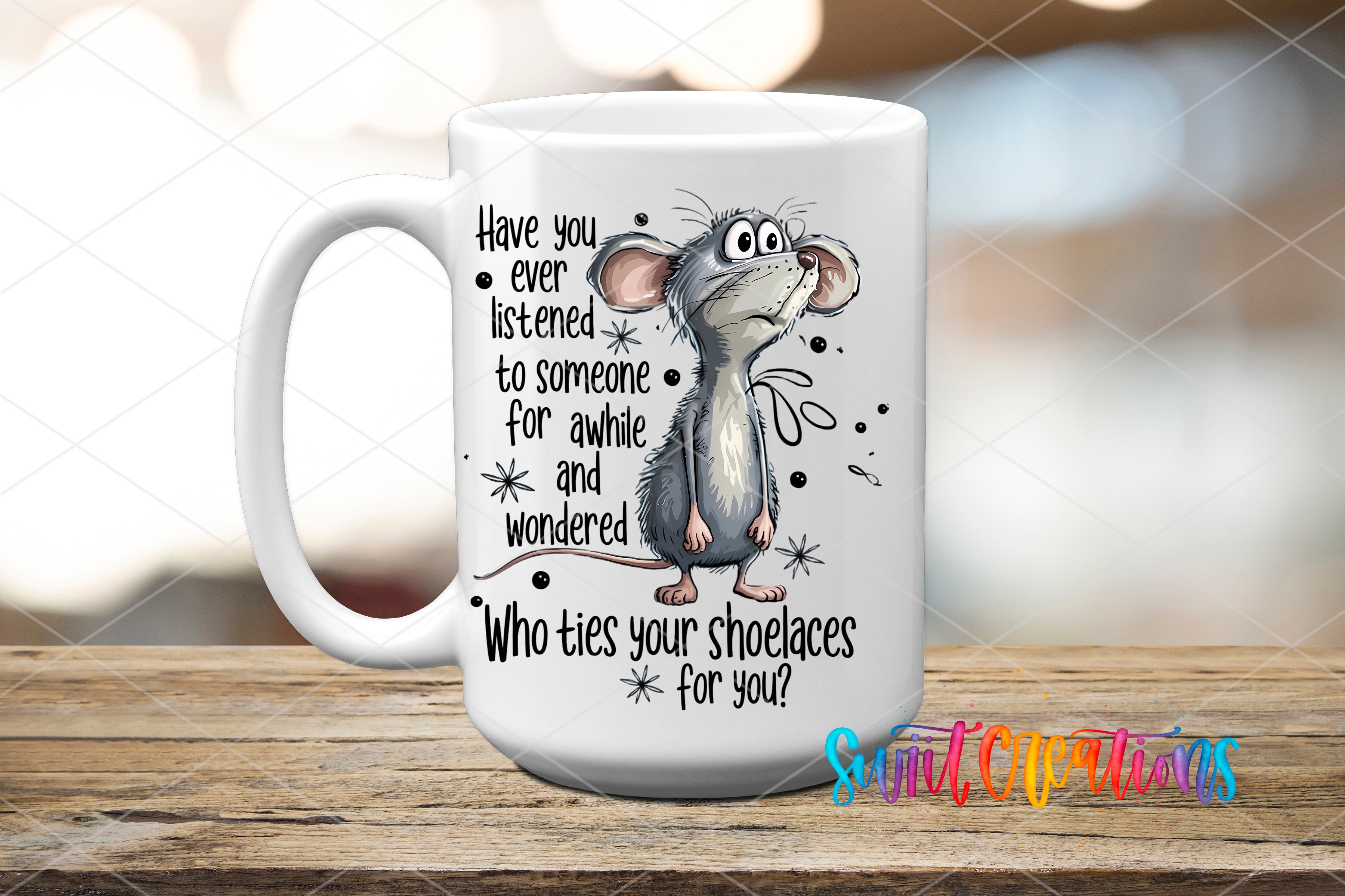 A white ceramic mug with a cartoon image of a mouse and text that reads "Have you ever listened to someone for awhle and wondered Who ties your shoelaces for you?"