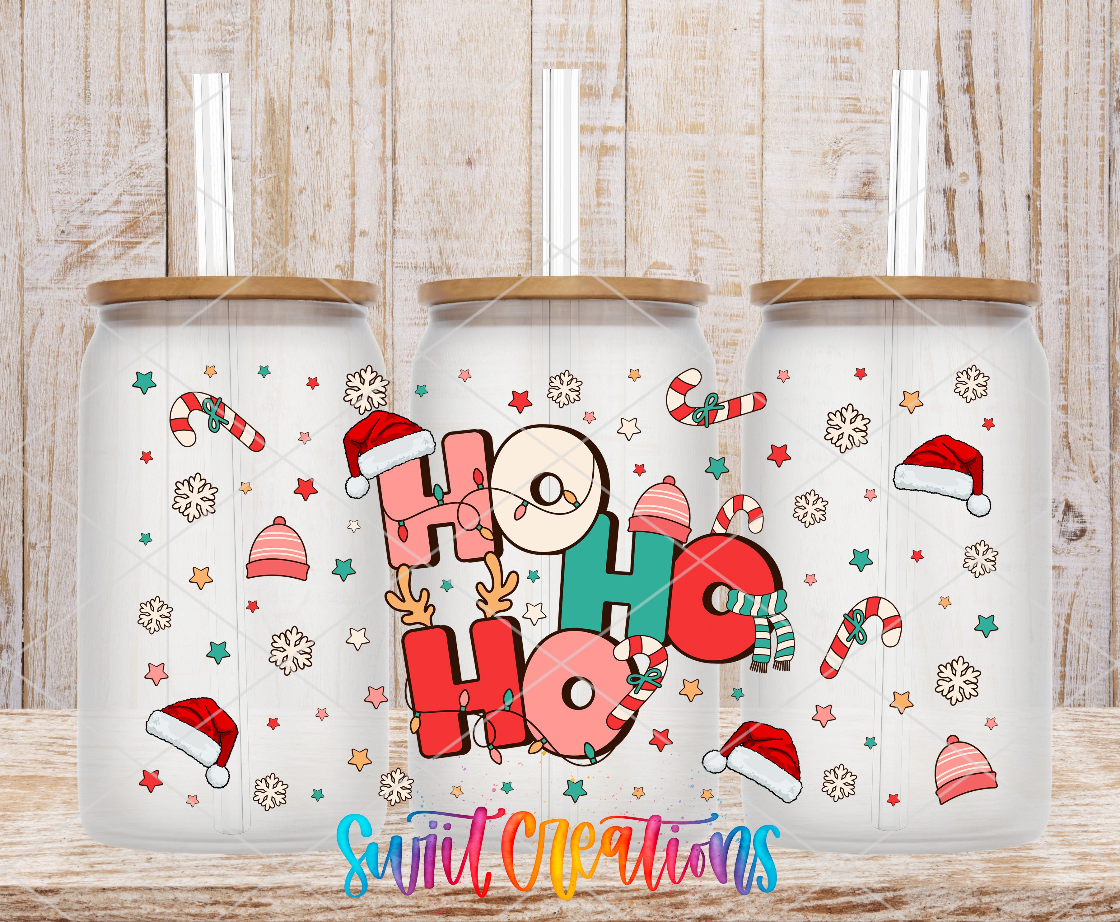 A collection of three glass tumblers with a festive holiday-themed design. The tumblers feature a variety of colorful elements, including snowflakes, candy canes, Santa hats, and the text "HOOK HOOK" in a playful font.