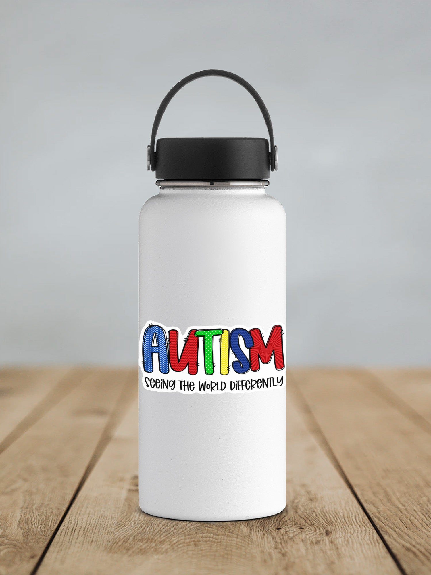 a white water bottle with the words autism printed on it