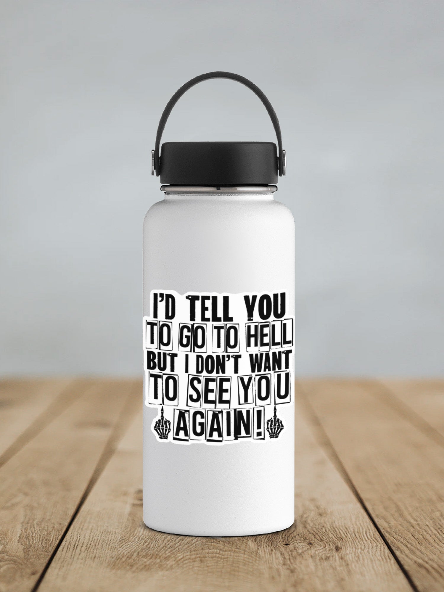 a white water bottle sitting on top of a wooden table