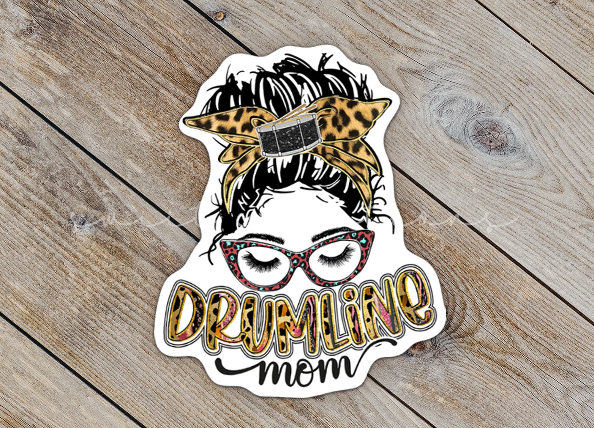 a sticker with a woman's face and a leopard print on it