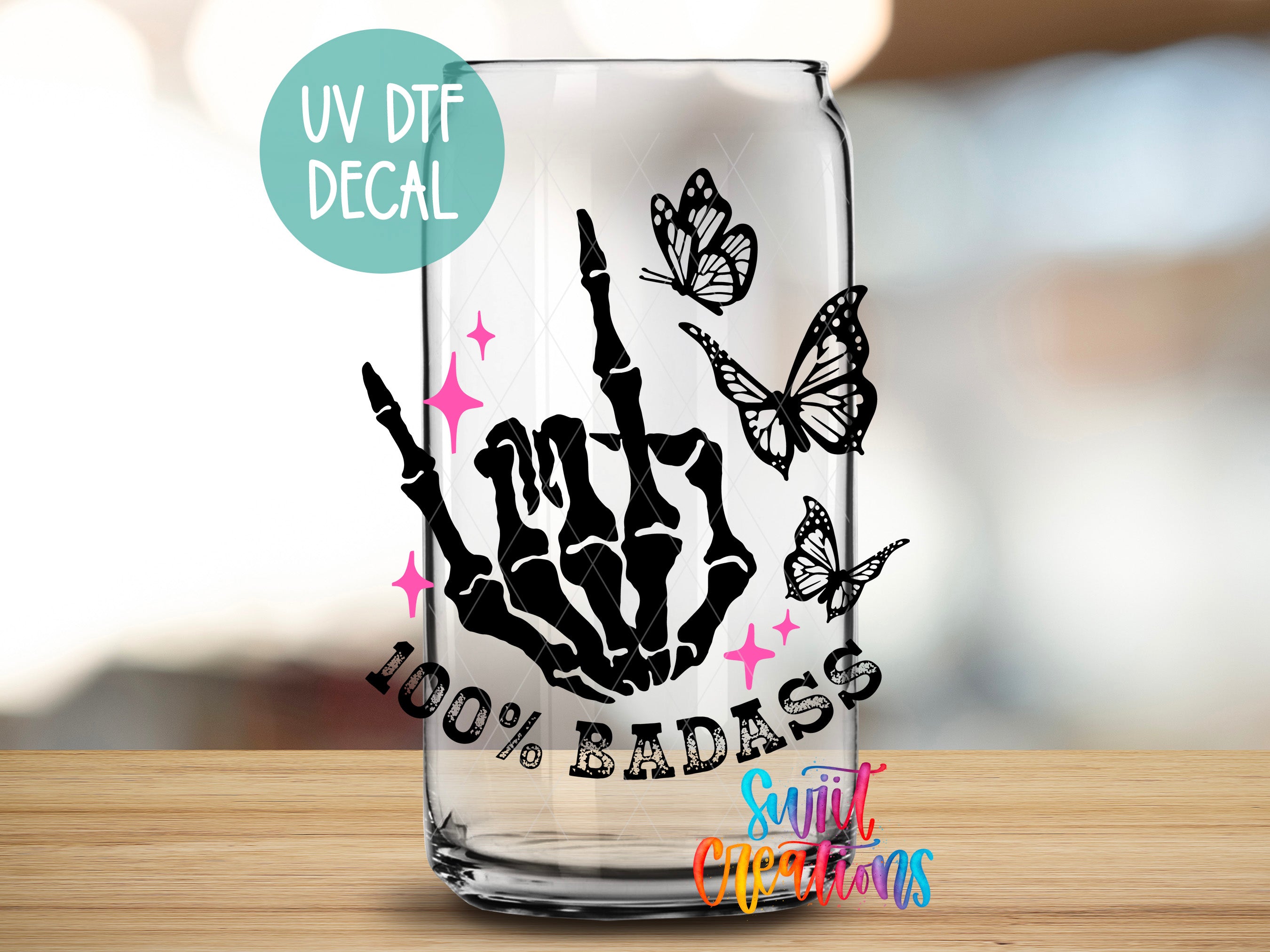 a glass with a picture of a hand holding a guitar