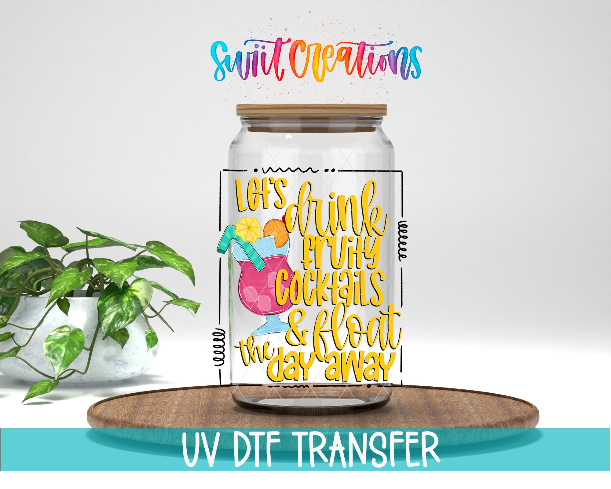 A glass jar with a colorful design and text, placed on a wooden tray, with a potted plant in the background.