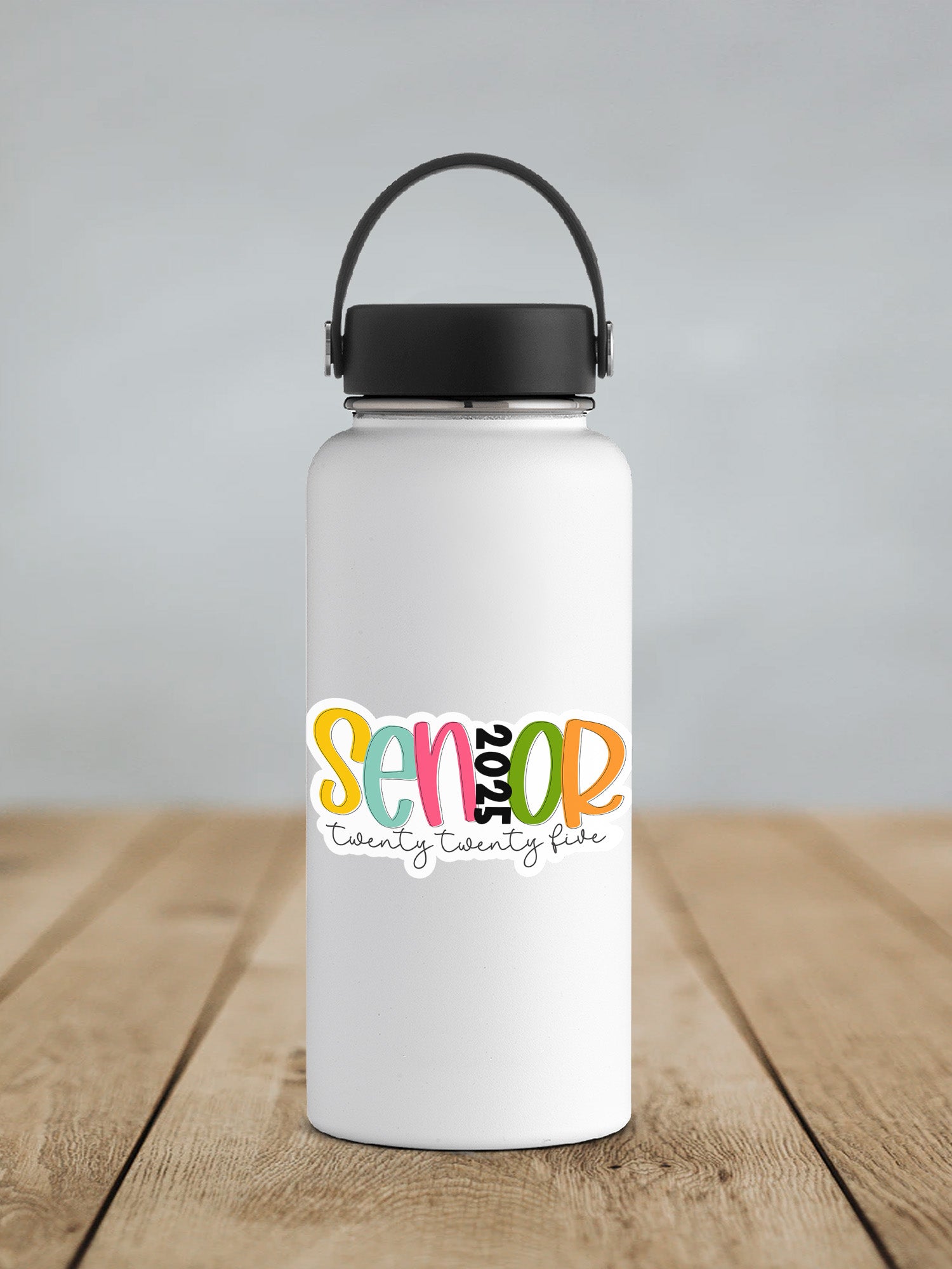 a white water bottle sitting on top of a wooden table