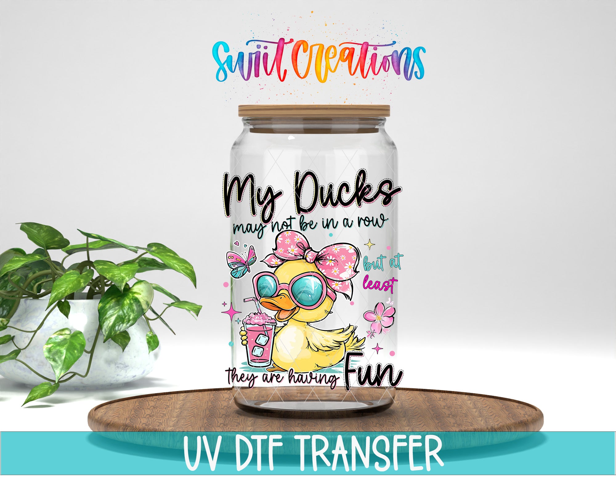 A glass jar with a cartoon duck and sunglasses on it, placed on a wooden surface. The jar has a label with text and illustrations.