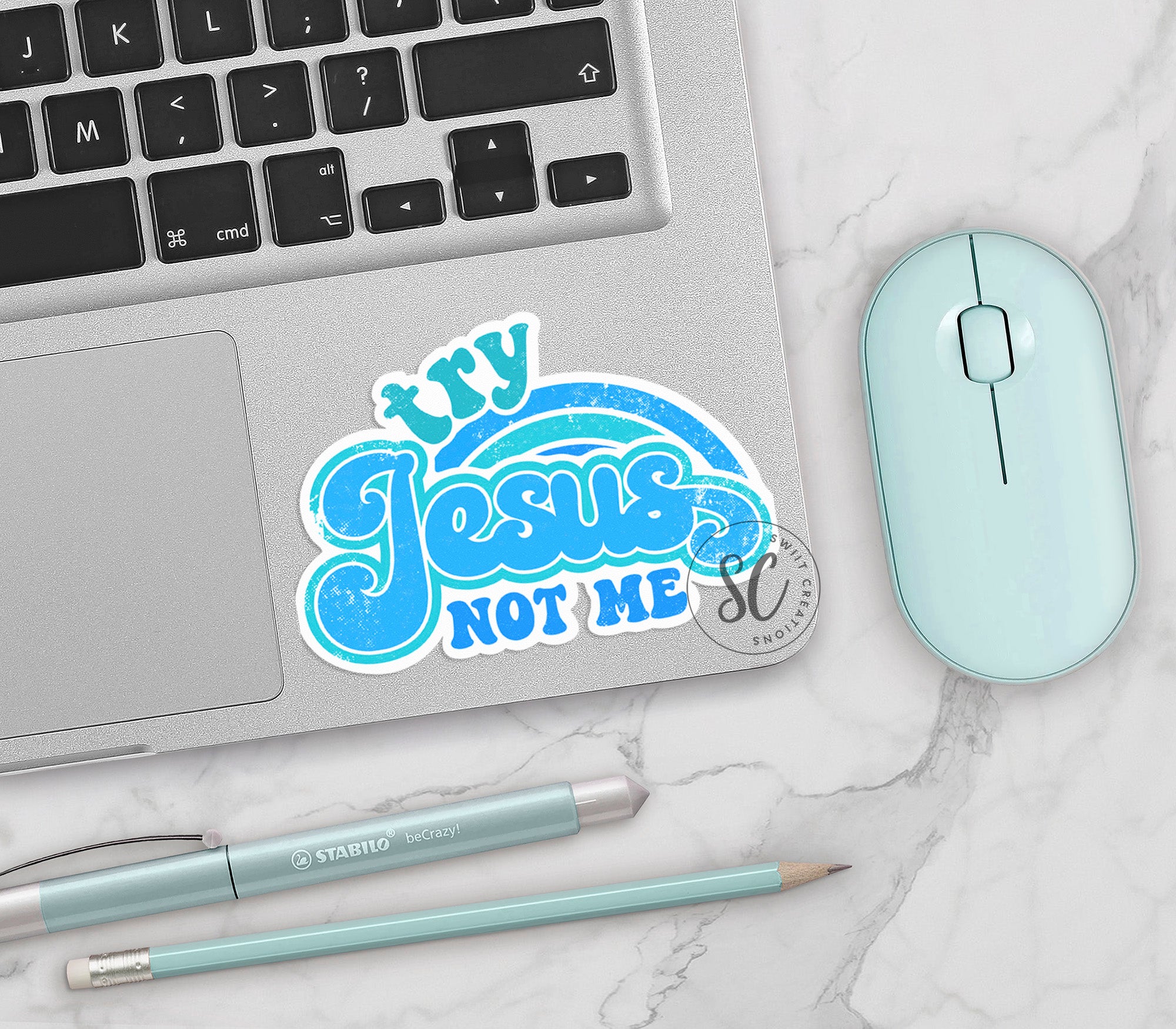 a laptop computer sitting on top of a white table