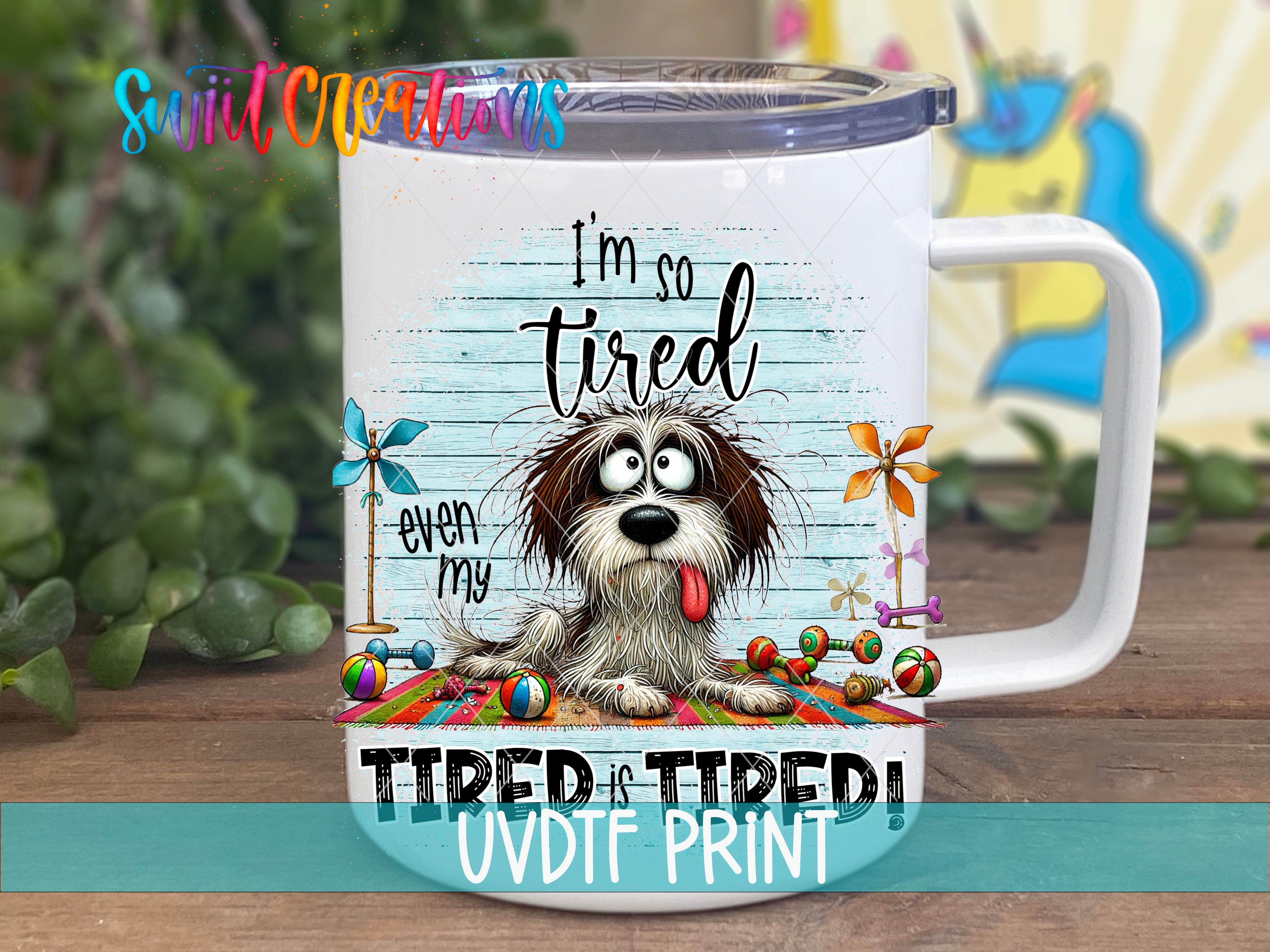 A mug with a cartoon dog and the text "I'm so tired even my tongue is tired" printed on it.