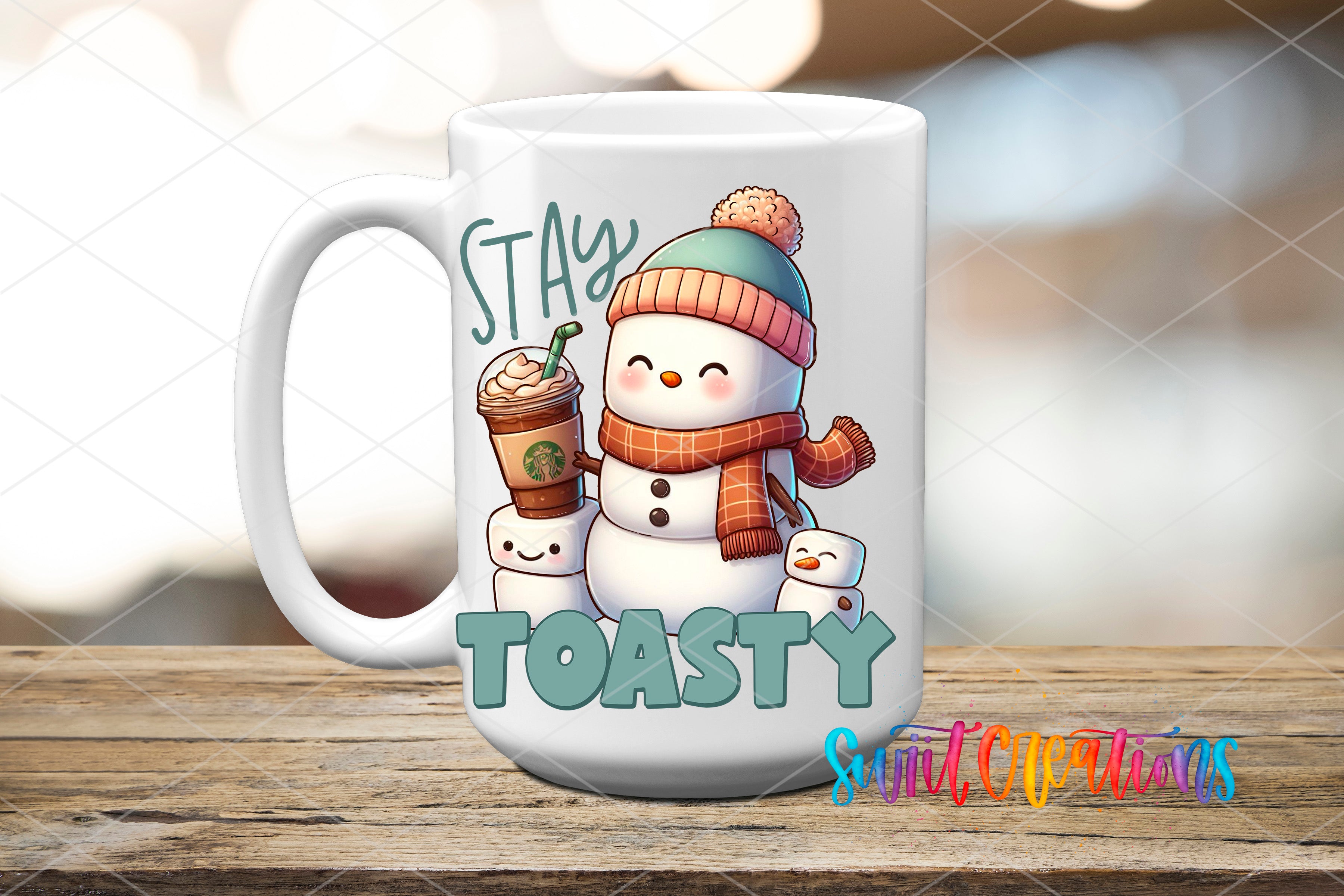 A white mug with a snowman and a cup of coffee, along with the text "STAY TOASTY" and "Suit Creations" printed on it.