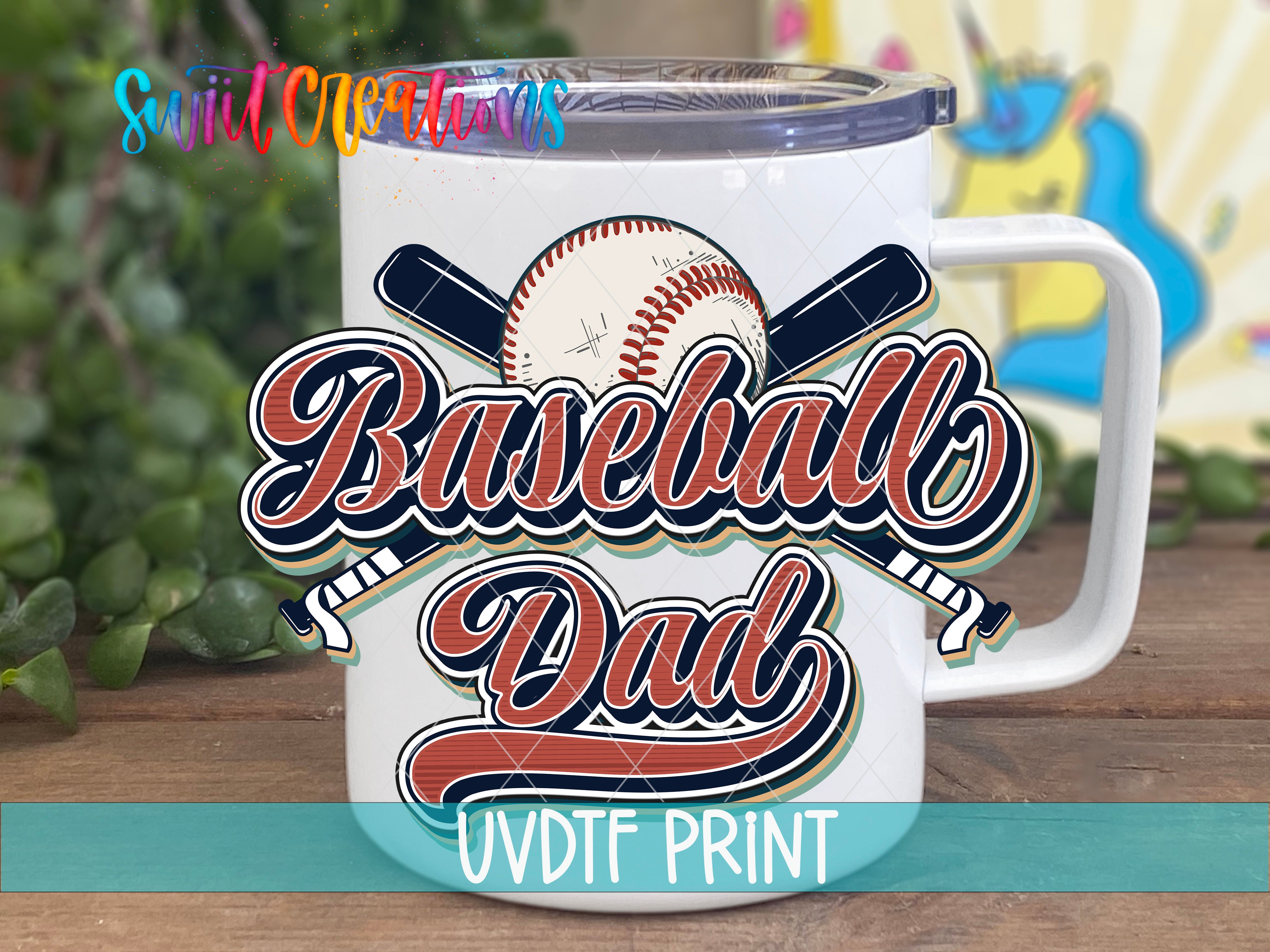 A white mug with a baseball design and the text "Baseball Dad" printed on it.