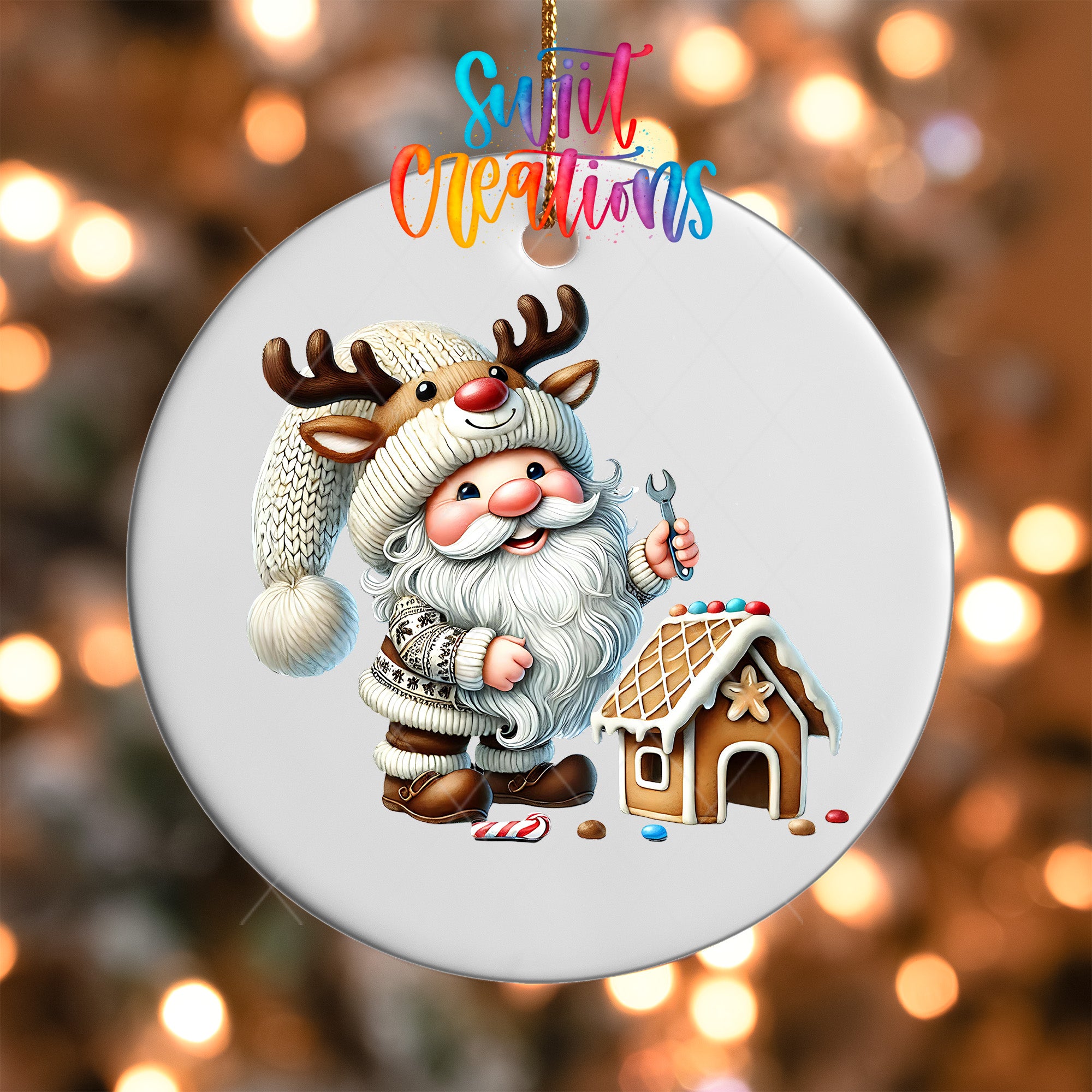 A white ornament featuring a cartoon Santa Claus character wearing a knitted hat and holding a wrench, standing next to a gingerbread house.