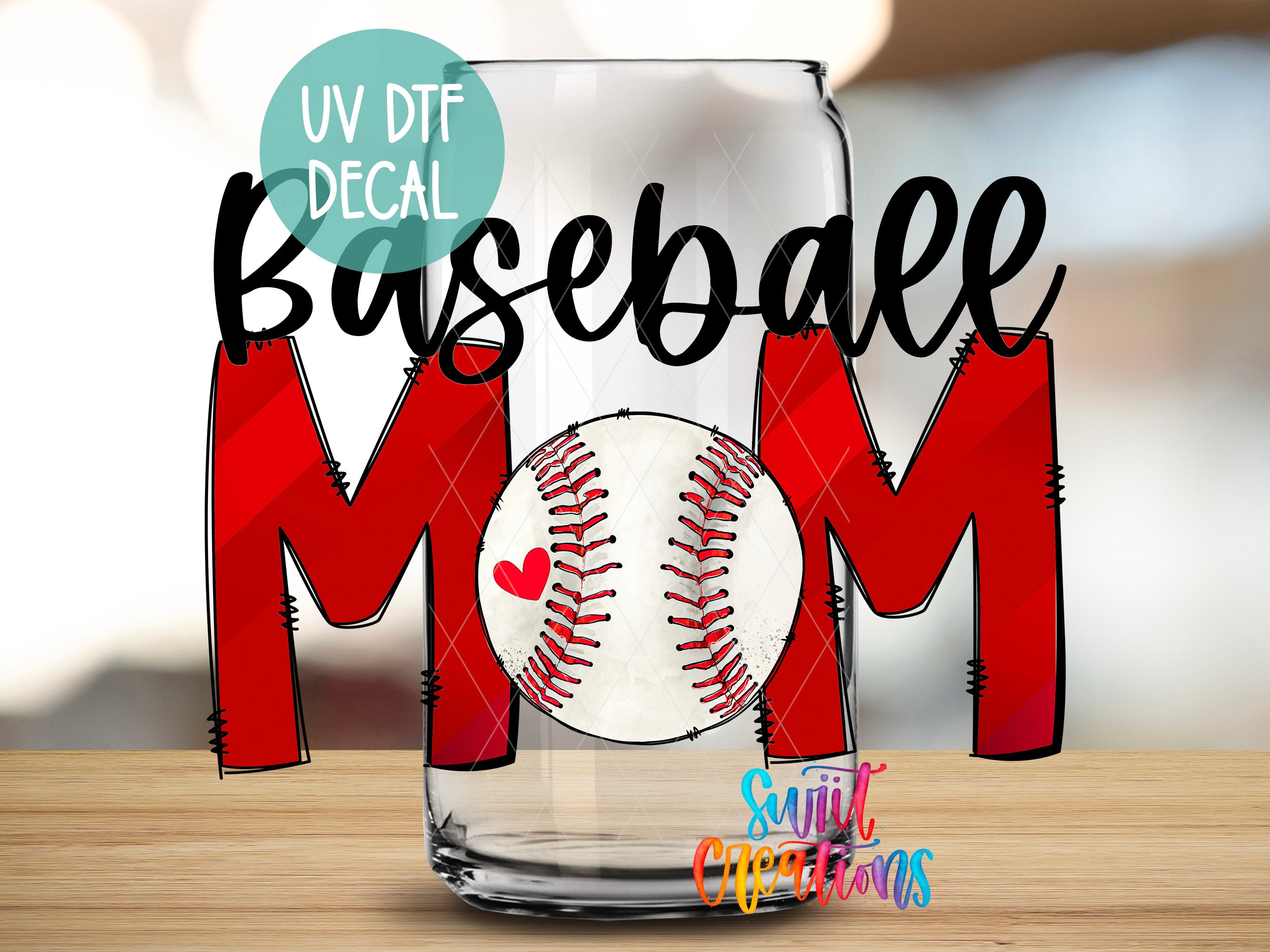 a glass with a baseball on it sitting on a table