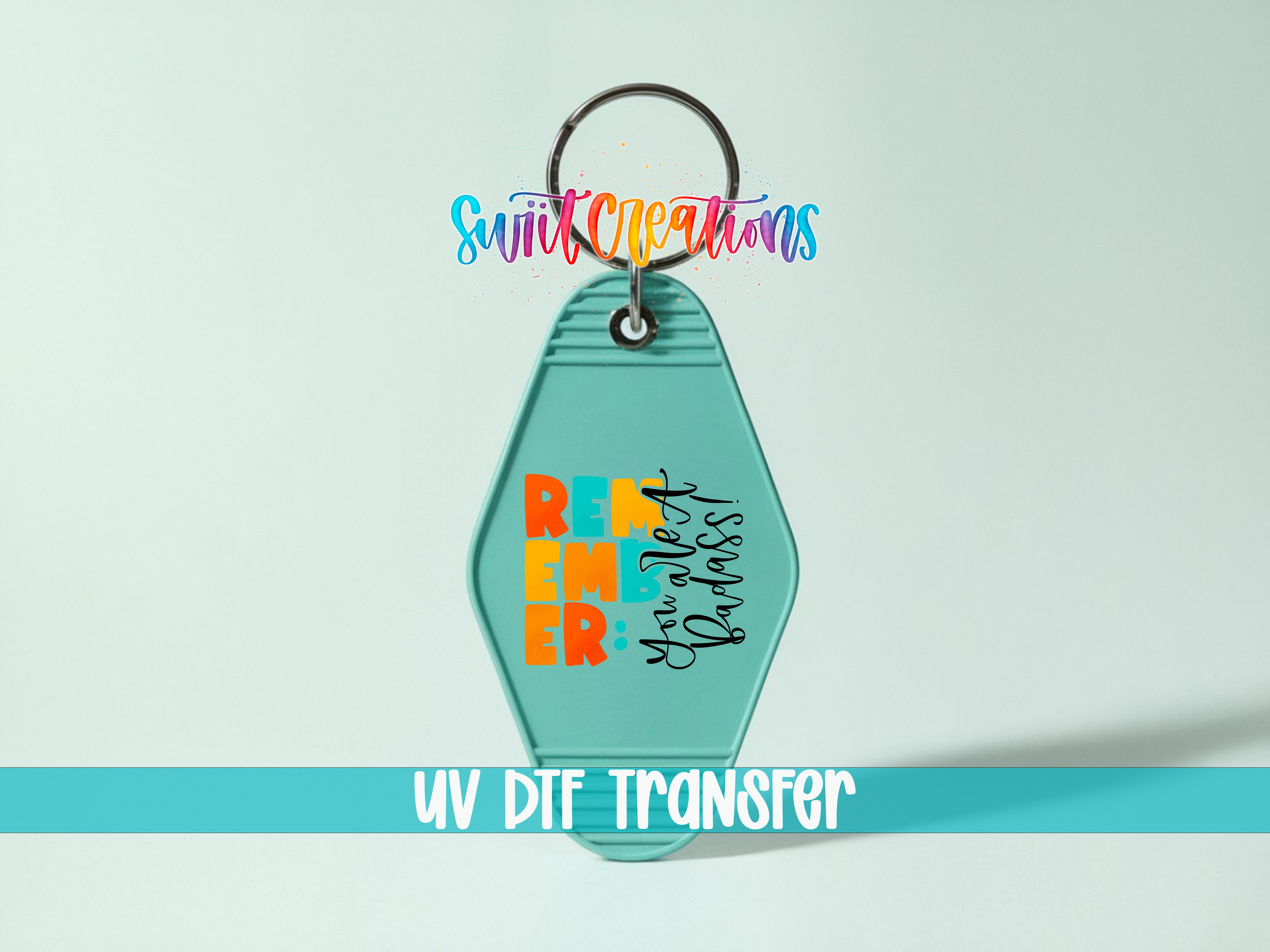 A keychain with a message printed on it, and the text "UV DIF TRANSFER" below it.