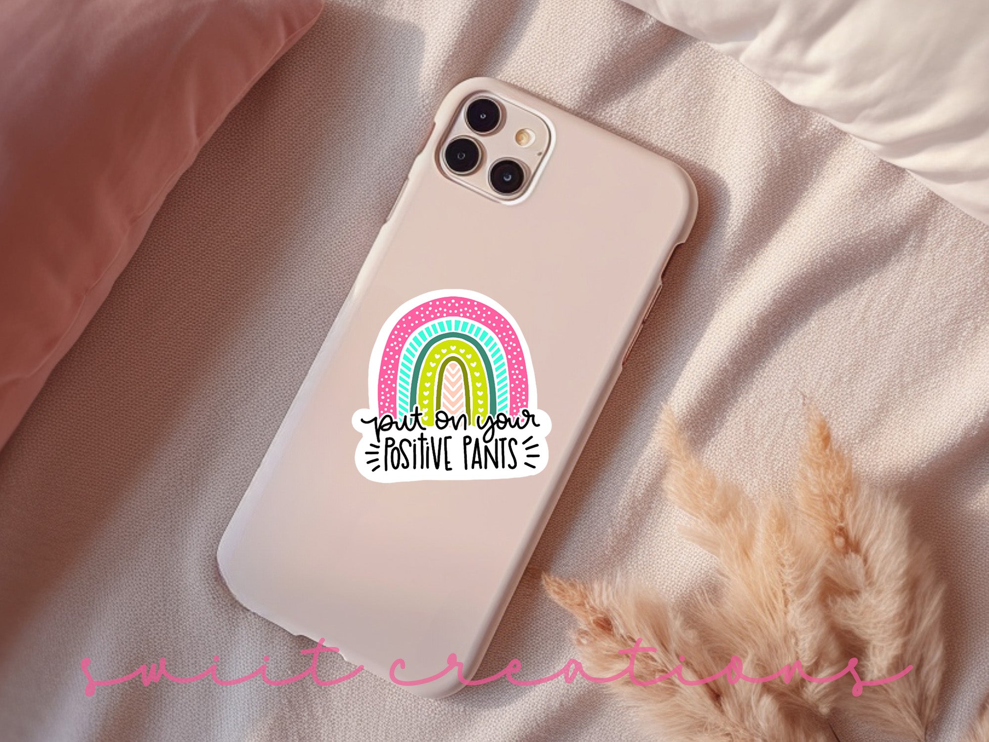 a phone case with a rainbow sticker on it