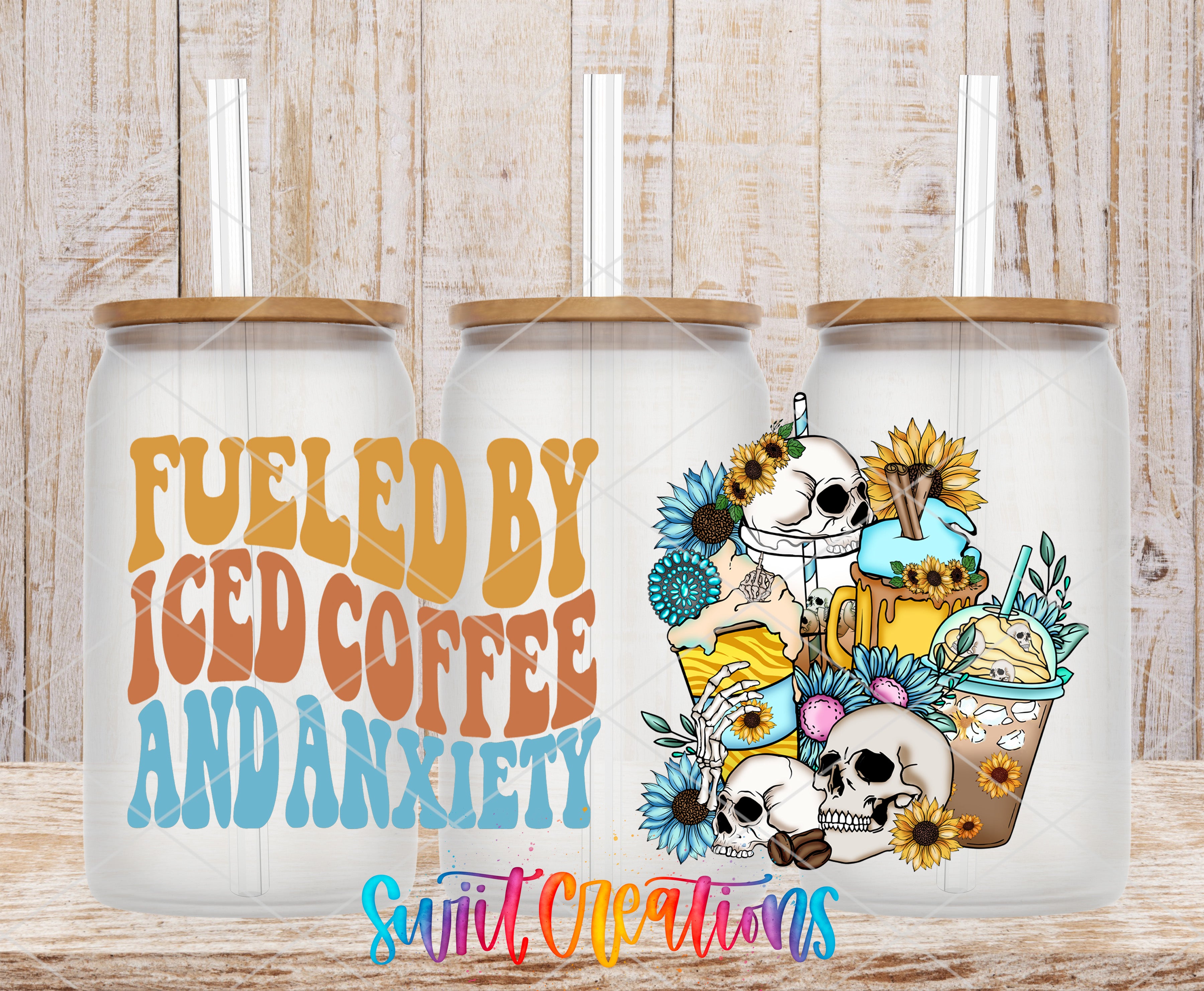 three glass tumblers with colorful designs and text on them.