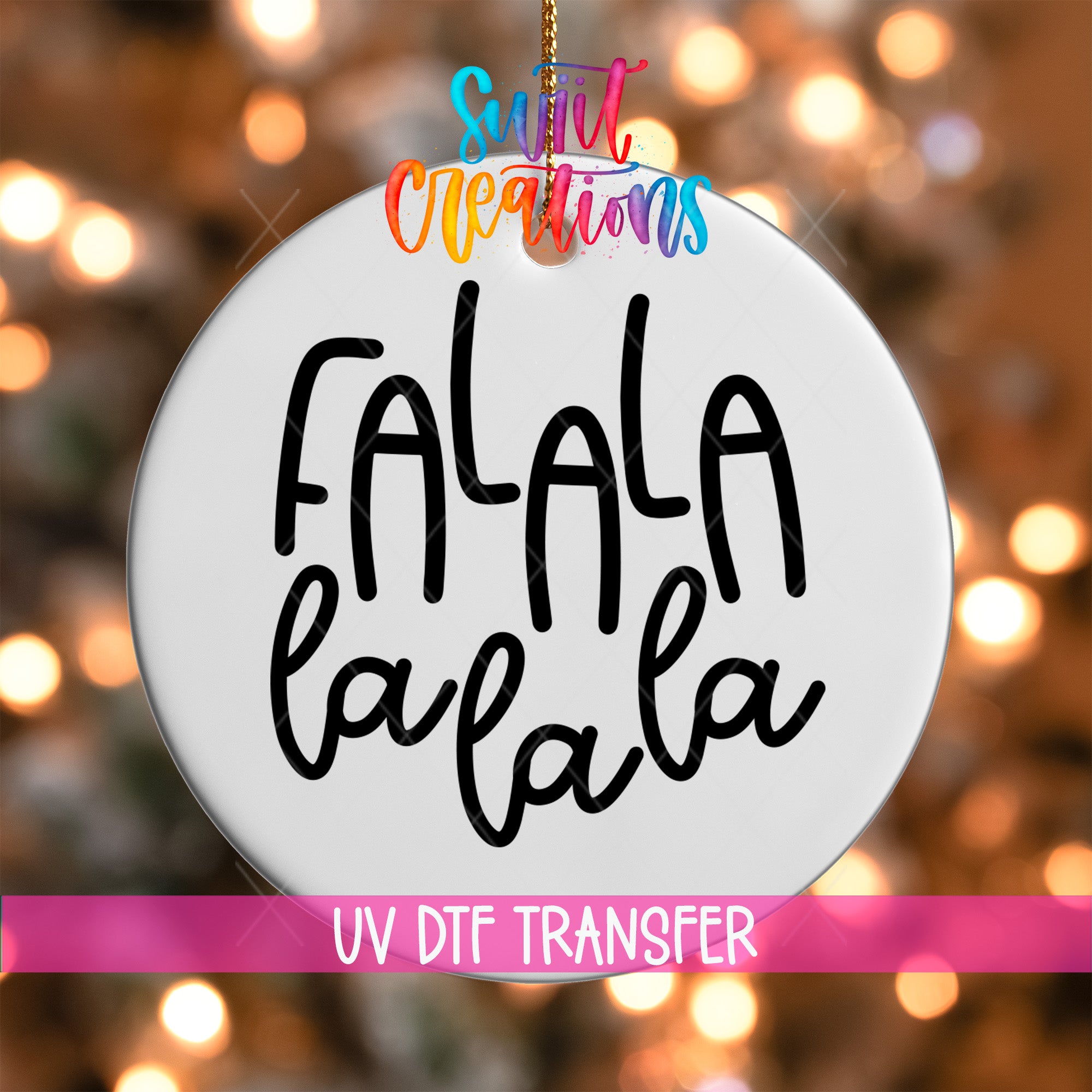 A white ornament with the text "FALA" written on it, hanging against a background of colorful lights.