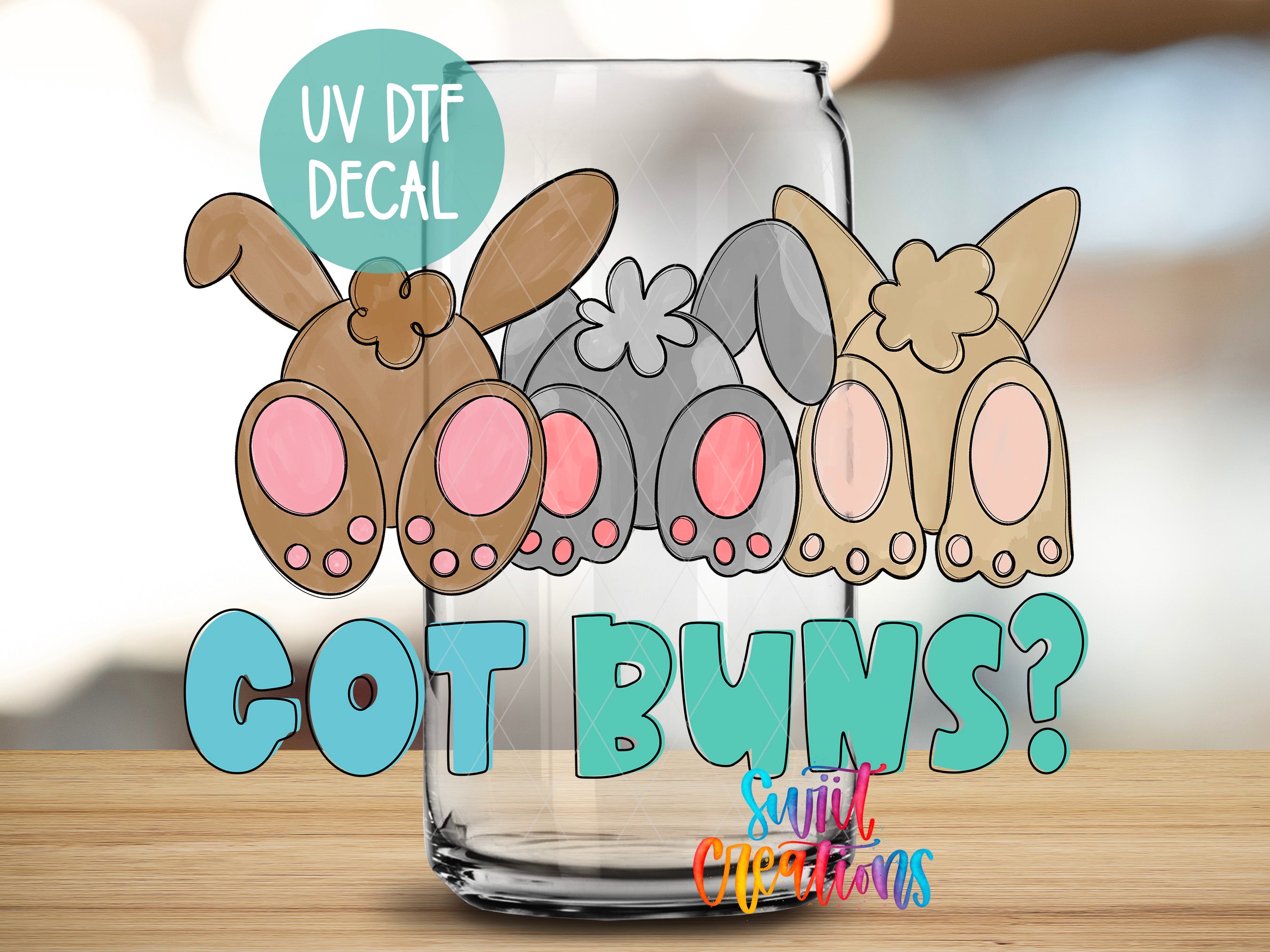 A glass jar with a UV decal featuring cartoon rabbit ears and the text "Got Buns?"