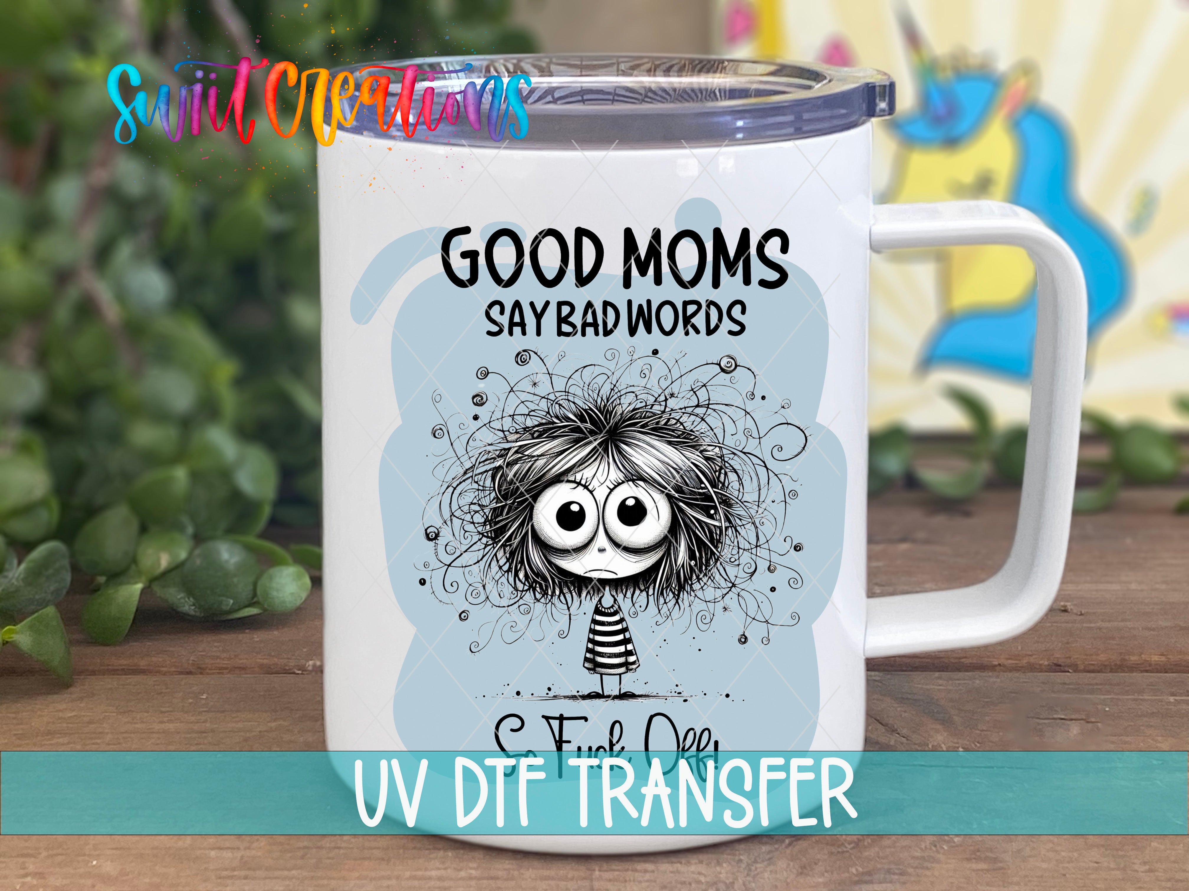 A white ceramic mug with a cartoon character and text printed on it, placed on a wooden surface.