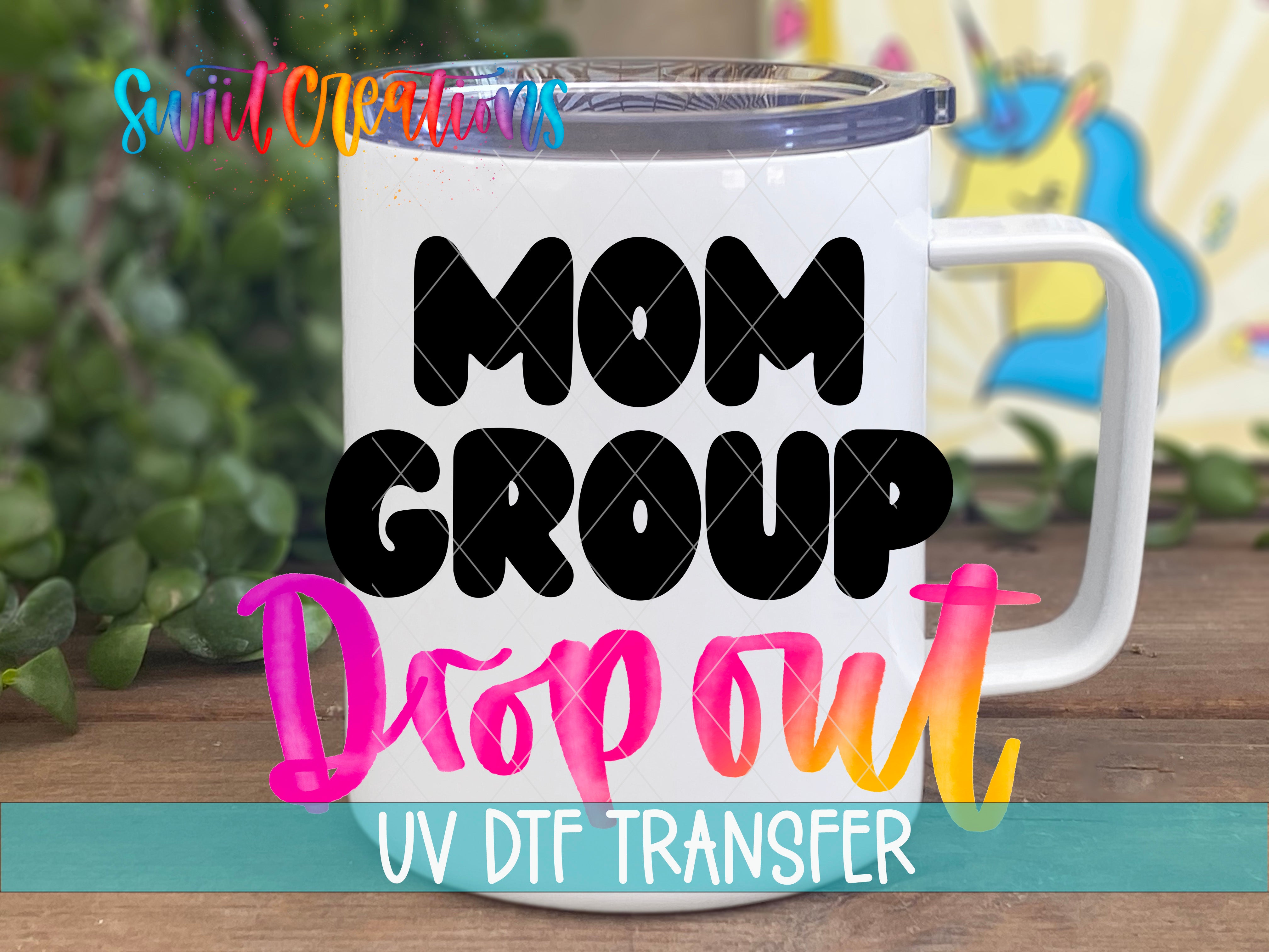 A white mug with the text "MOM GROUP Dropout UV Dtf Transfer" printed on it, along with a colorful graphic of a unicorn in the background.