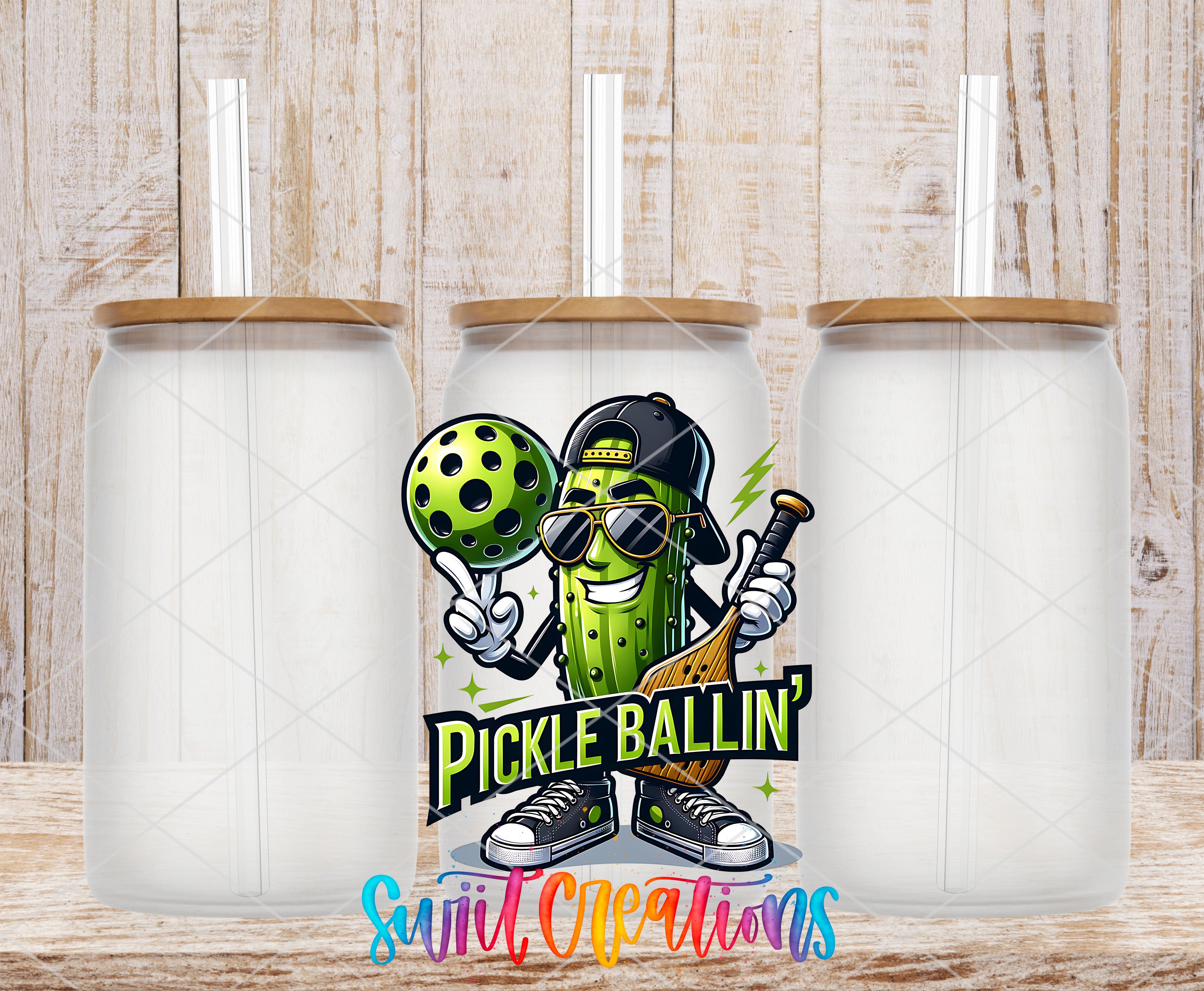 a cartoon pickle character holding a paddle and a ball, with the text "Pickle Ballin'" and "Suitable Creations" below the character.