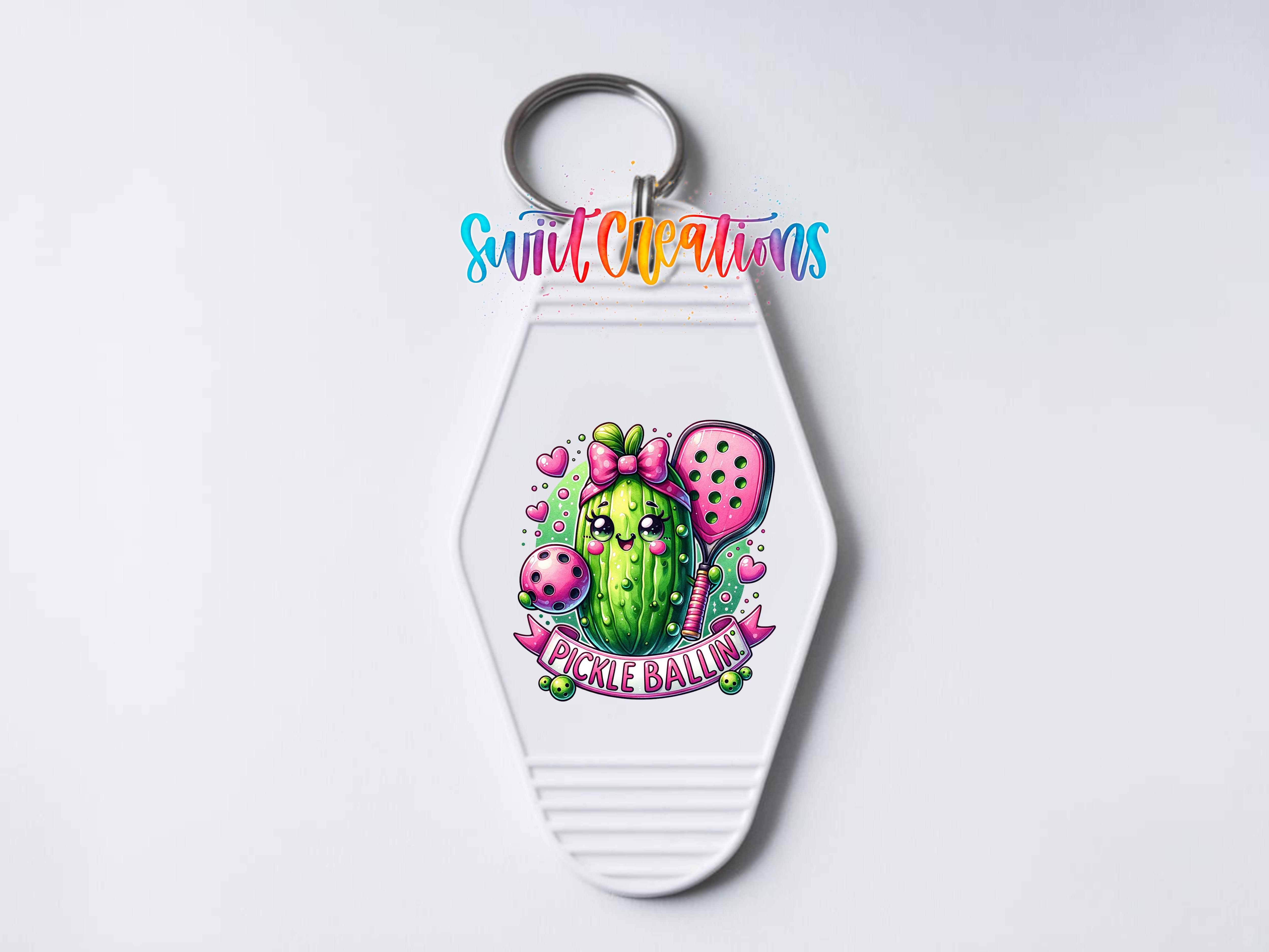 A keychain with a colorful design featuring a cactus and the text "Pickle Ballin" on it.