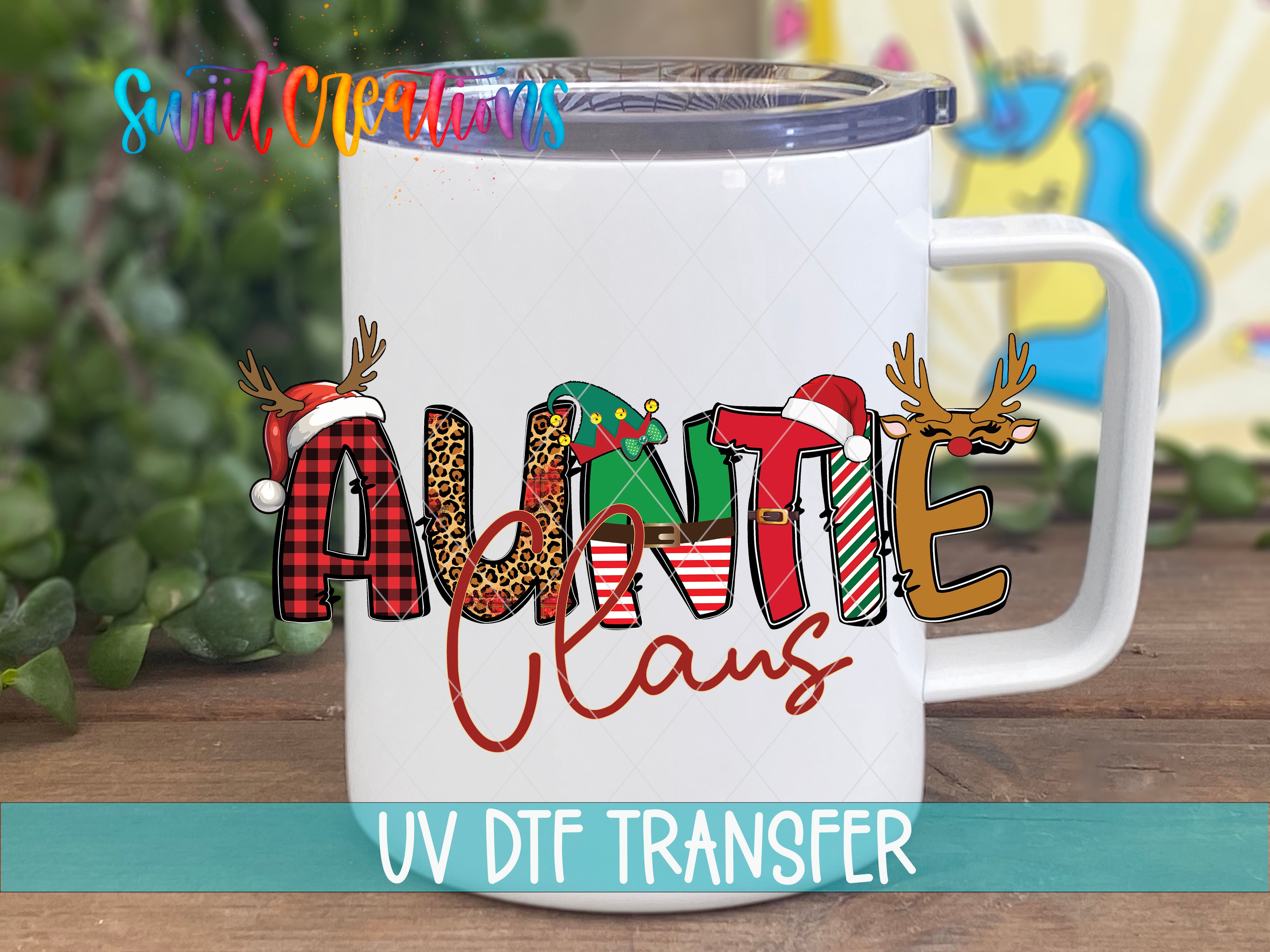 A white mug with a colorful design featuring the word "Auntie Claus" and various holiday-themed elements such as reindeer and snowflakes.