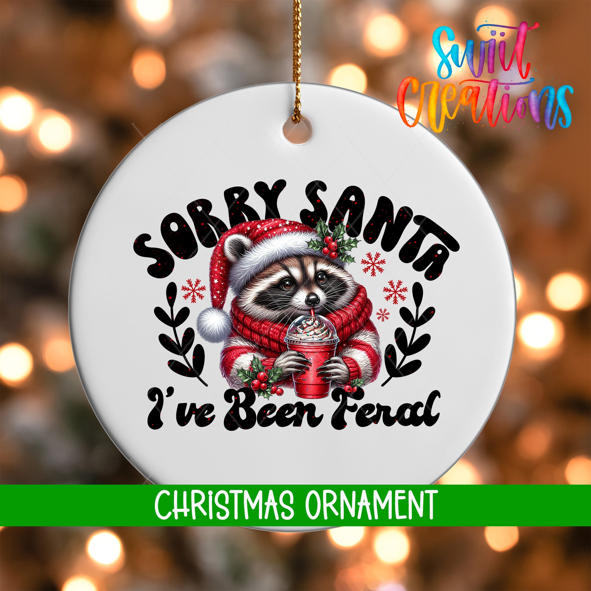 A white Christmas ornament with a raccoon wearing a Santa hat and scarf, holding a drink, and the text "Sorry Santa I've Been Ferald" printed on it.