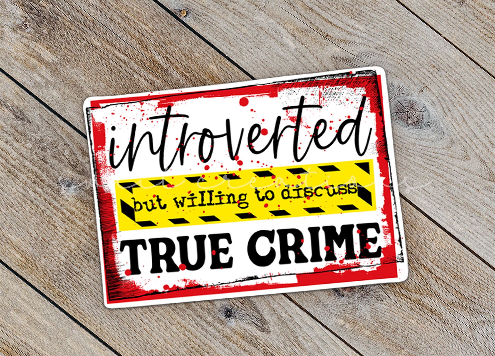 a sign that is on a wooden surface