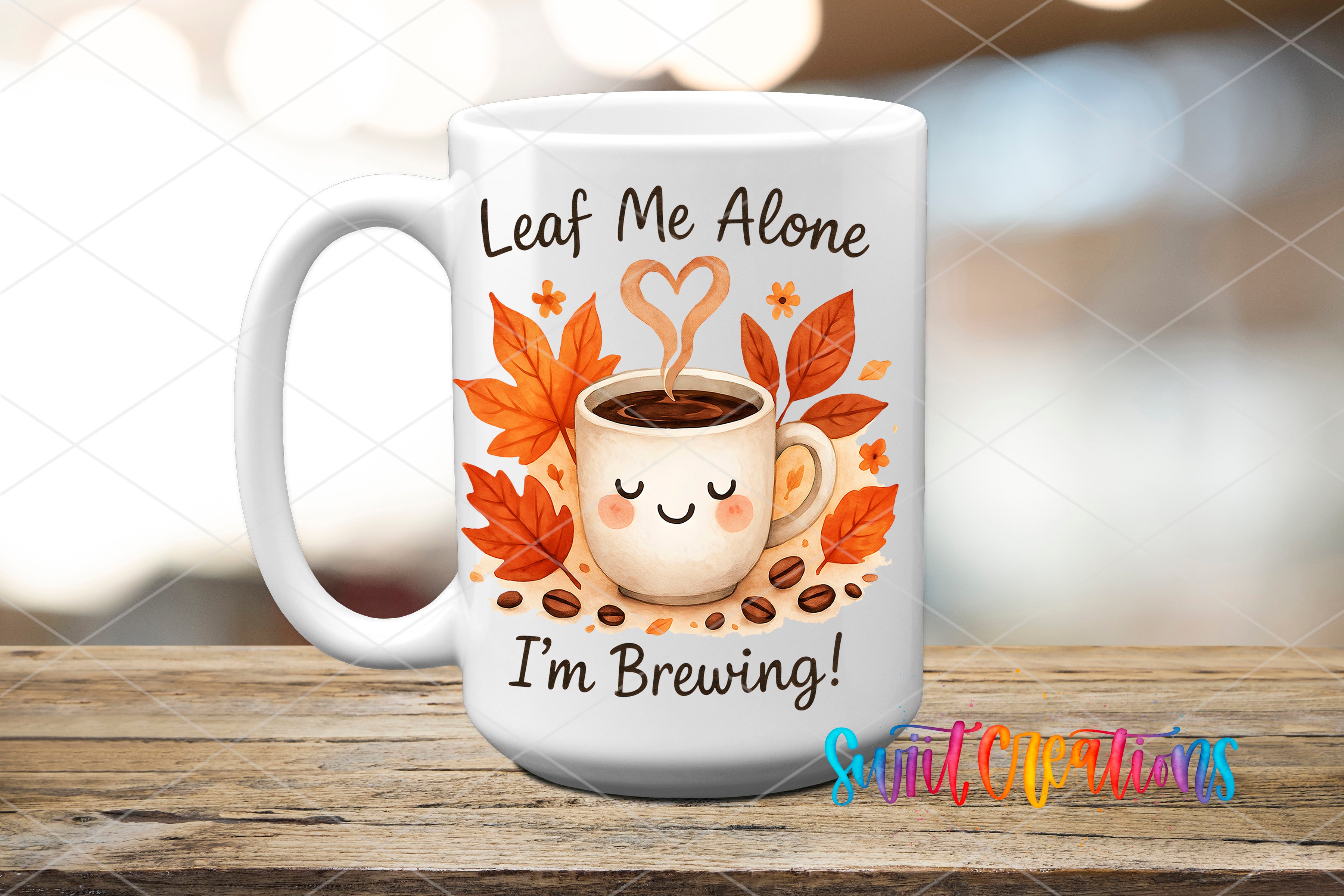 A white coffee mug with a cartoon image of a cup of coffee surrounded by autumn leaves and coffee beans, along with the text "Leaf Me Alone I'm Brewing!"