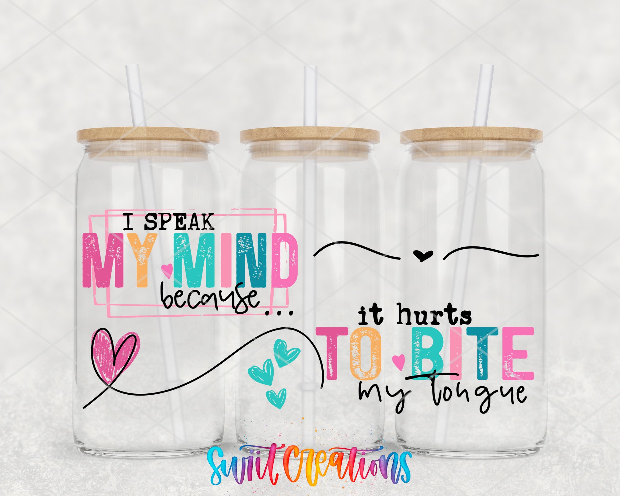 three clear glass jars with wooden lids, each with a straw. The jars have colorful text and heart designs on them.