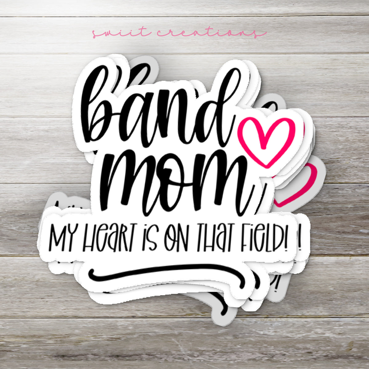 a sticker that says band mom my heart is on that hold