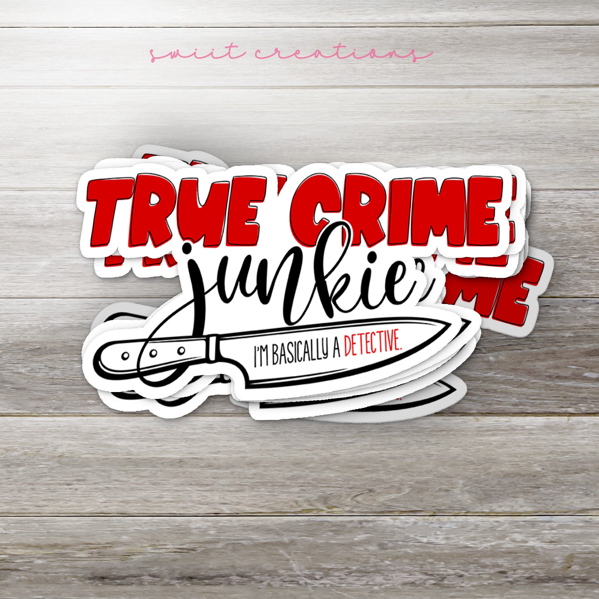 a sticker of a knife on a wooden surface