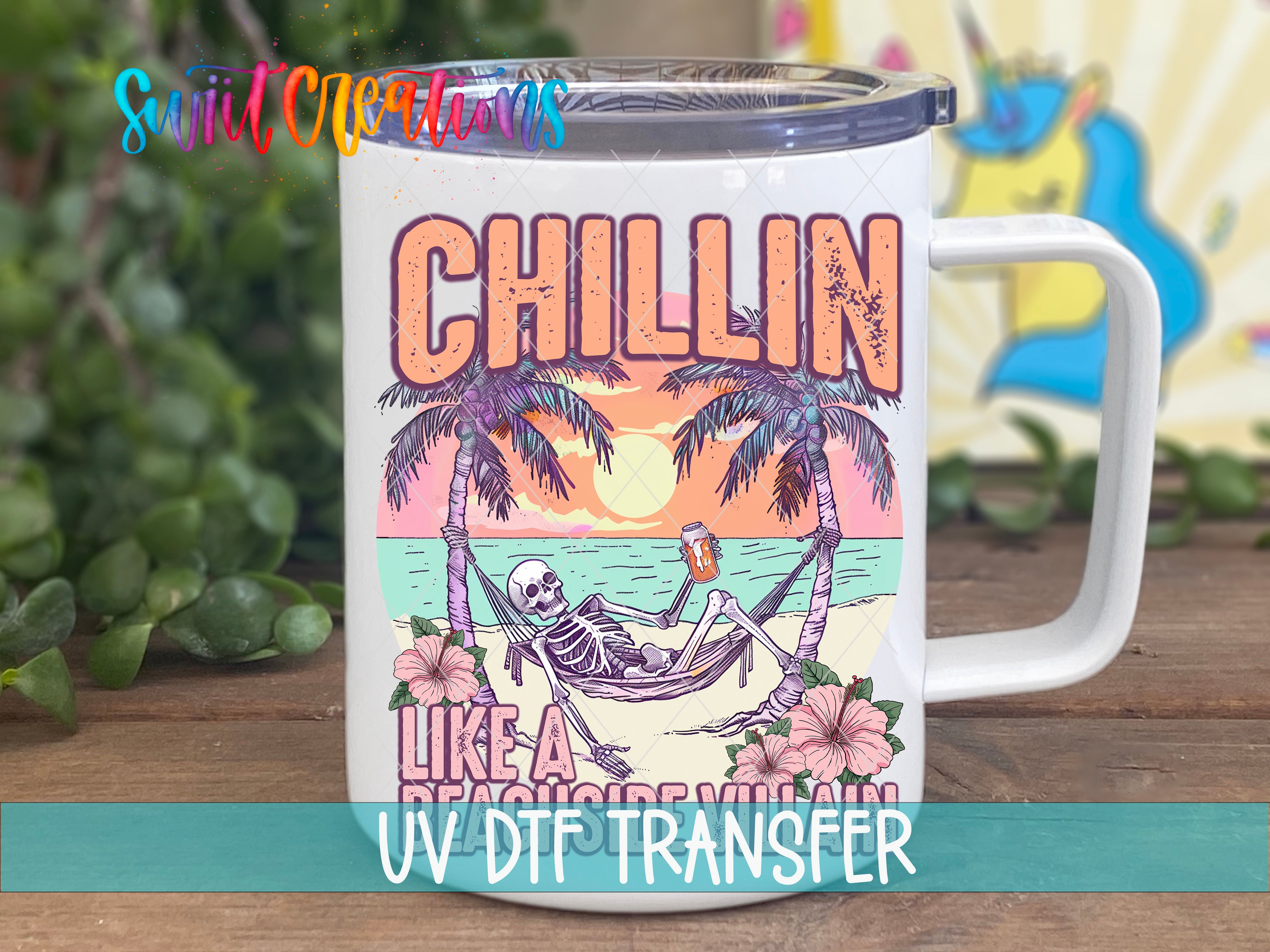 A white mug with a colorful graphic design depicting a skeleton relaxing in a hammock on a beach, with palm trees and a sunset in the background.