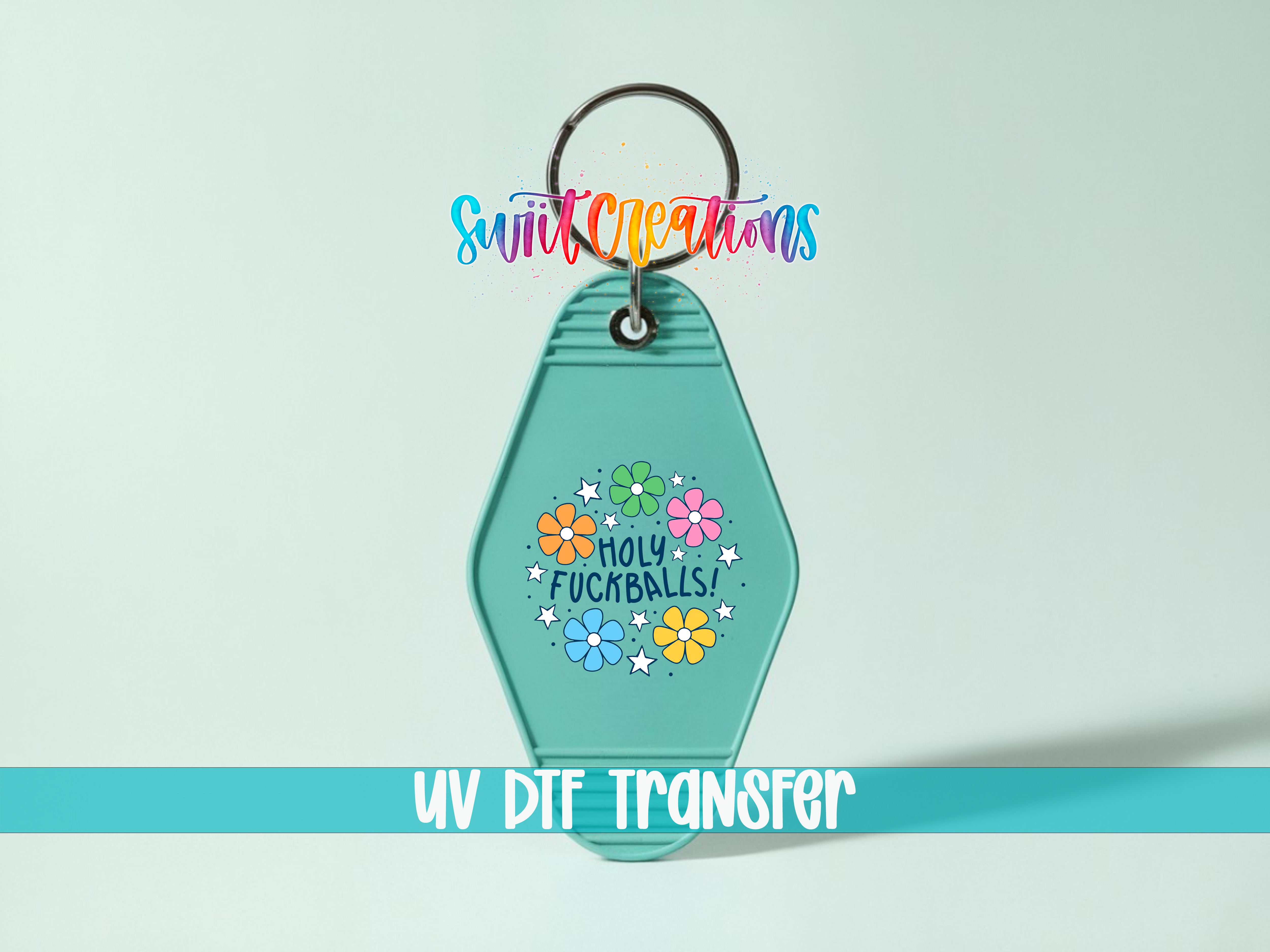 A keychain with a colorful design and text, including the phrase "Holly Fuckingballs!"