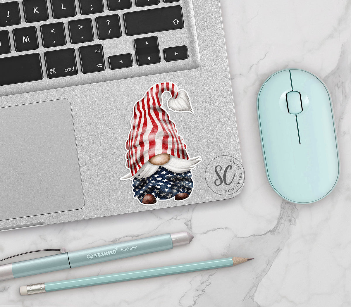 a laptop with a sticker of a gnome on it