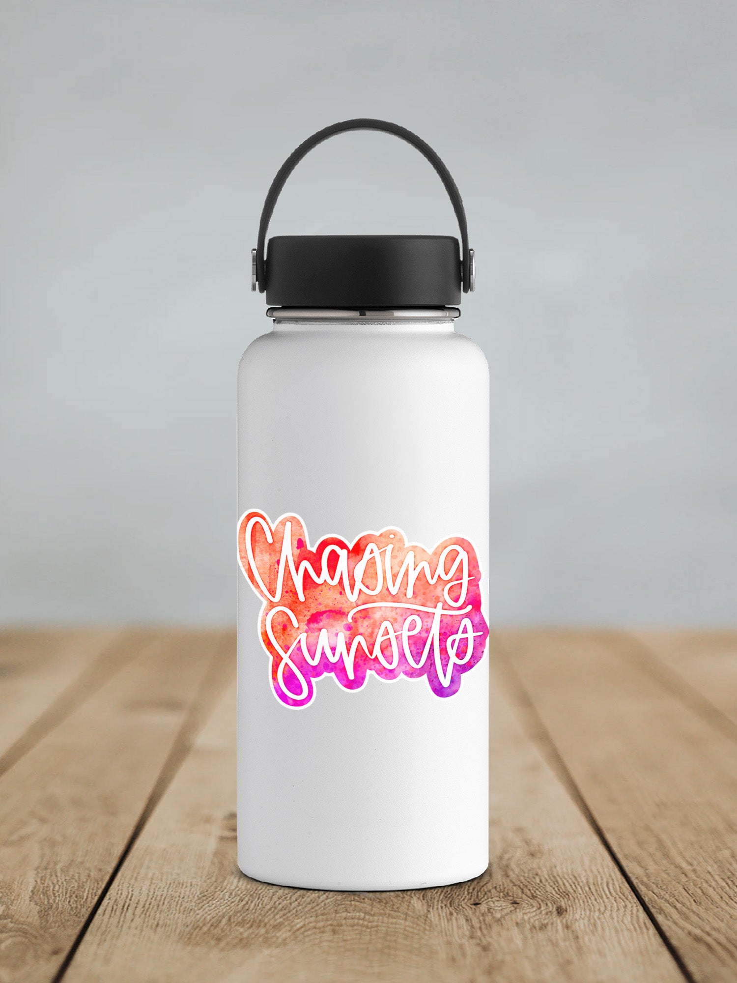 a white water bottle with a black lid on a wooden table