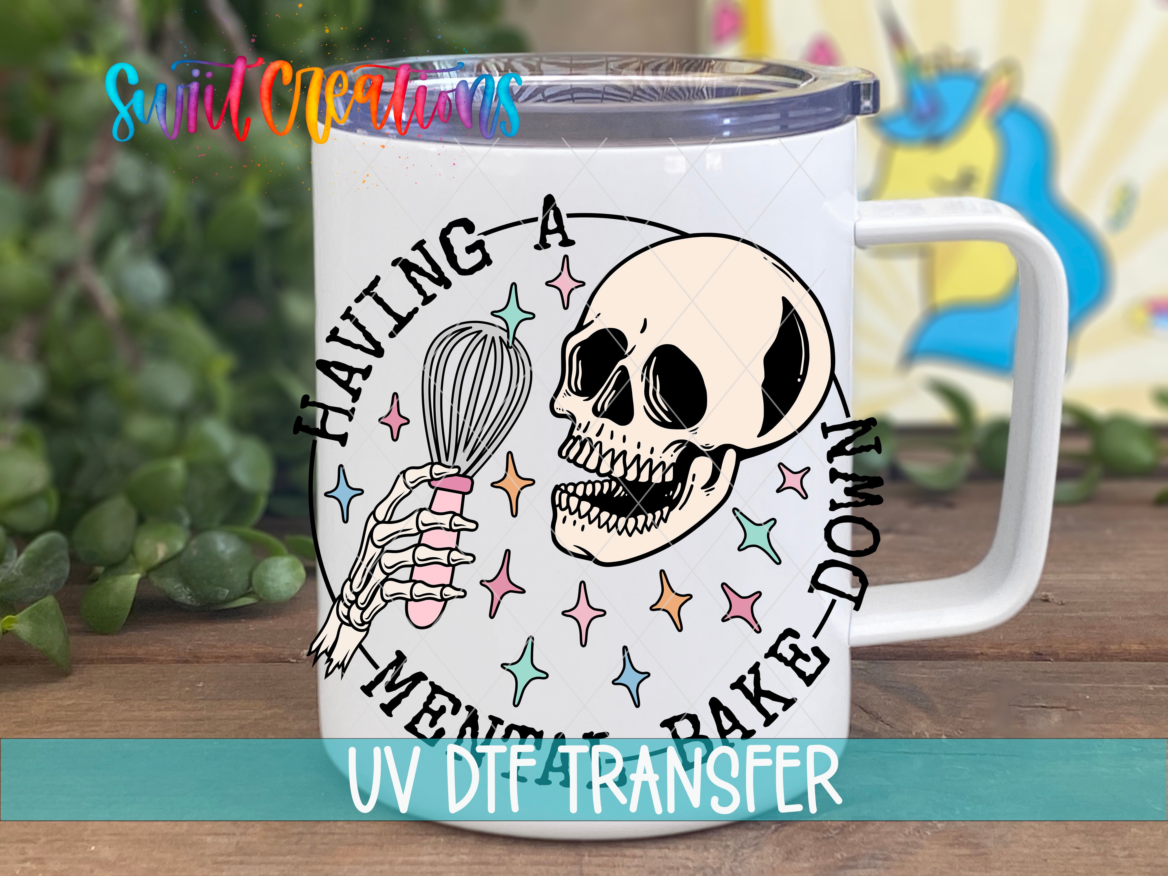 A white mug with a skull and a whisk graphic printed on it, along with colorful stars and a rainbow-colored background.