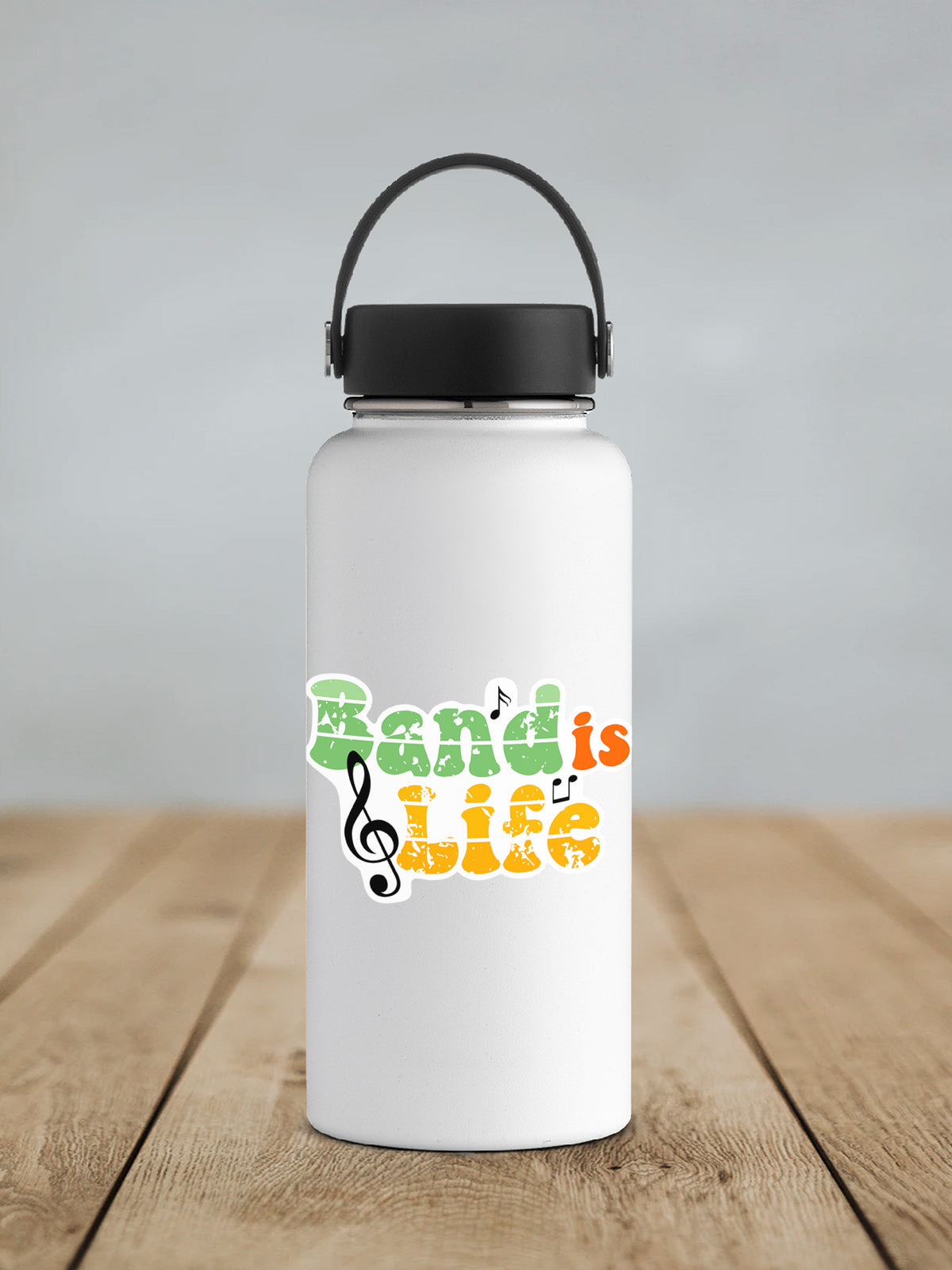 a white water bottle with a black lid on a wooden table