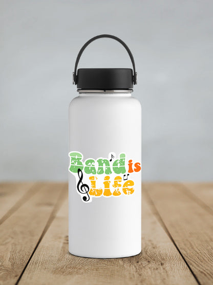 a white water bottle with a black lid on a wooden table