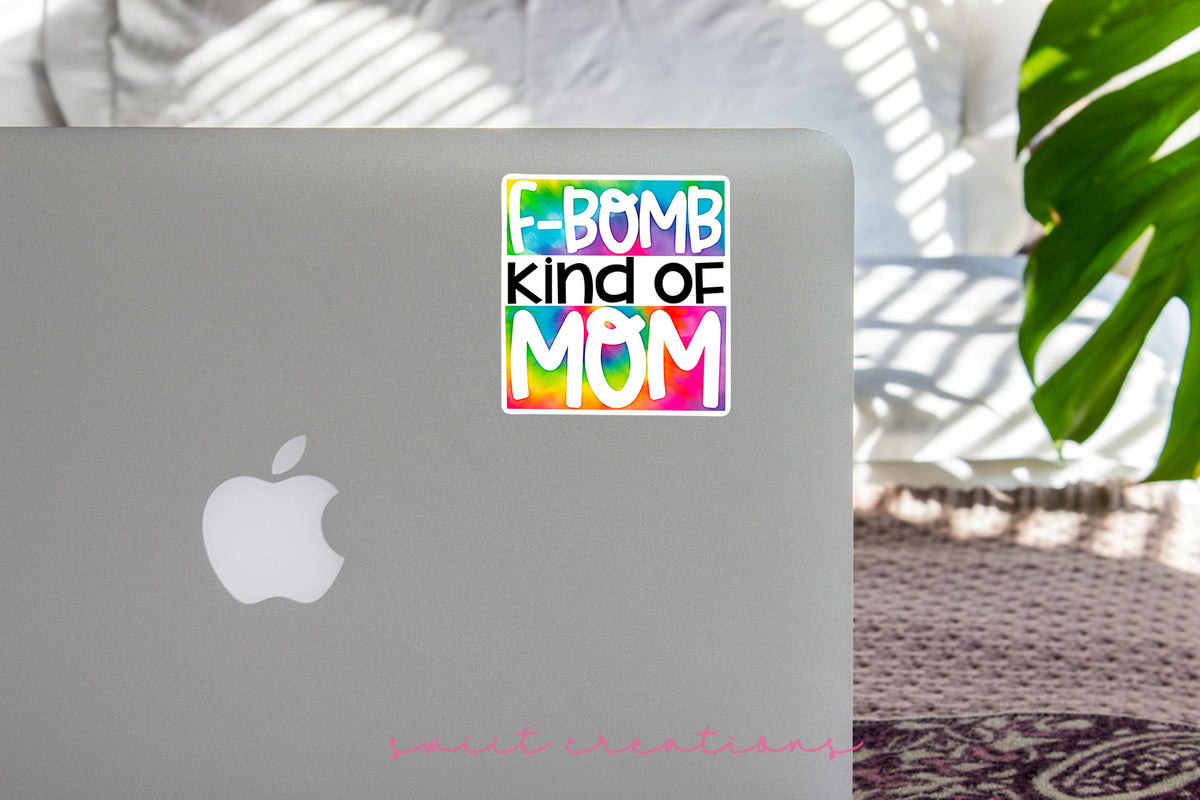a laptop with a sticker that says bomb kind of mom