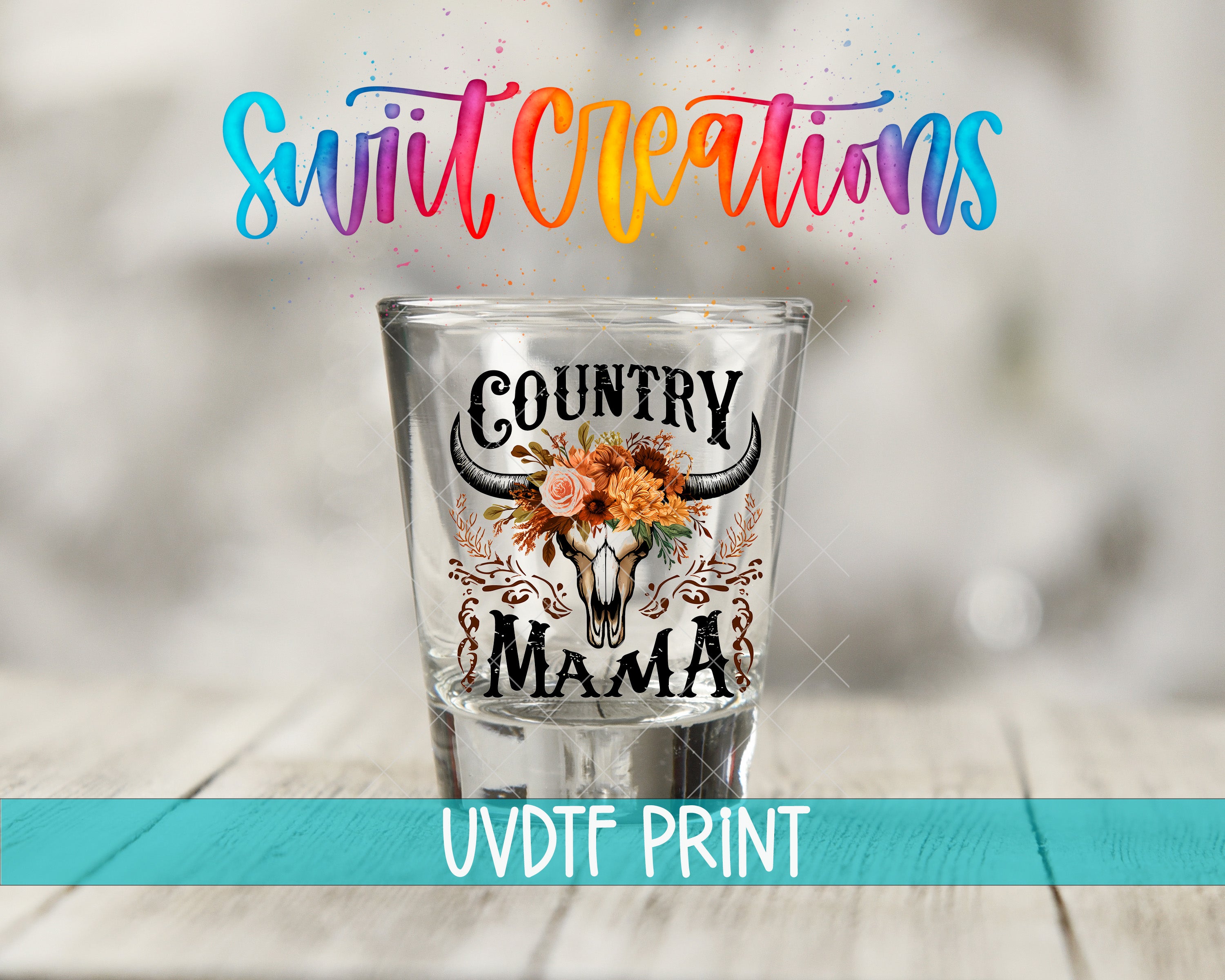 a shot glass with a floral design and the text "Country Mama" printed on it, placed on a wooden surface.