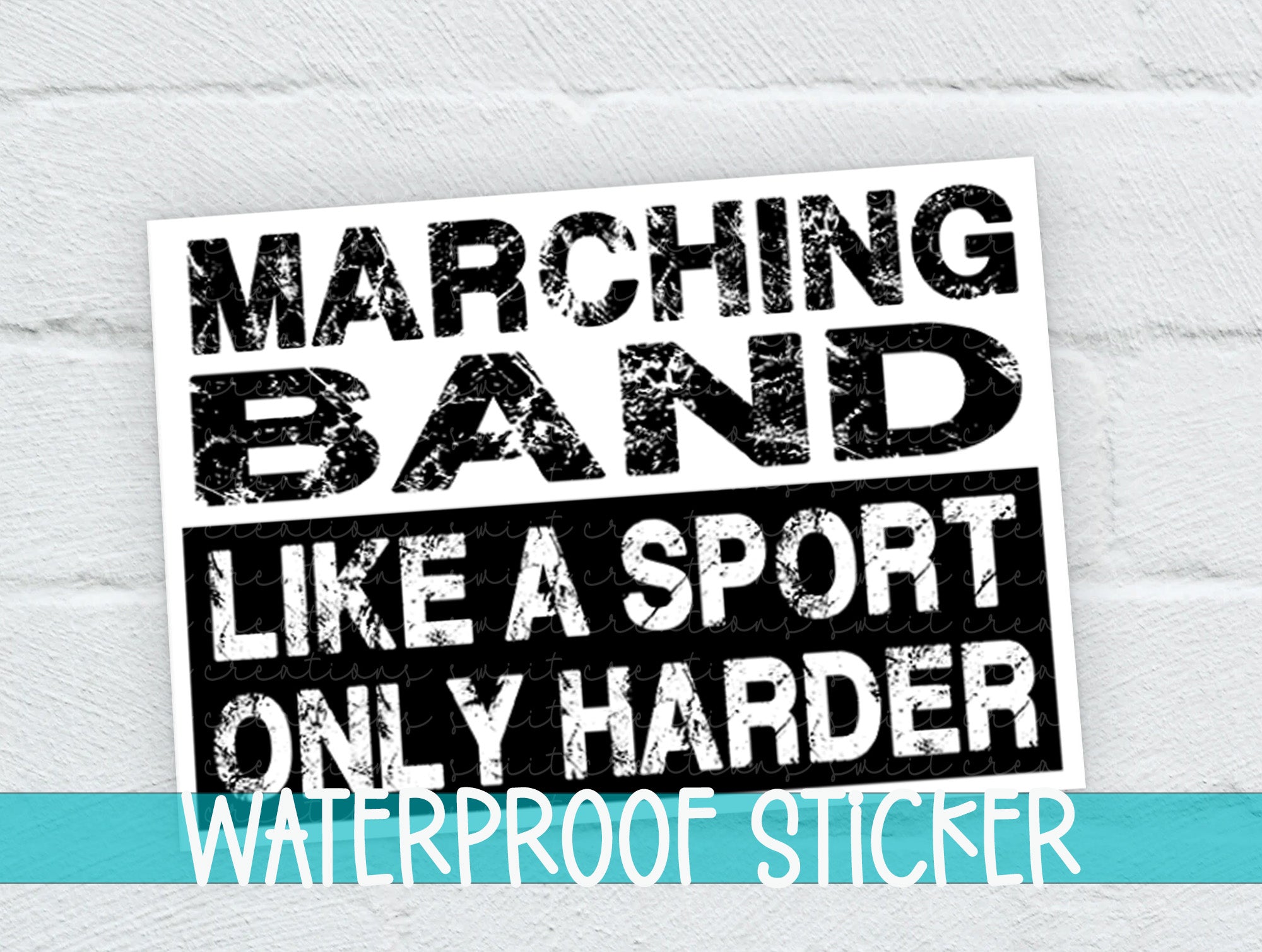 a white brick wall with a black and white sticker on it