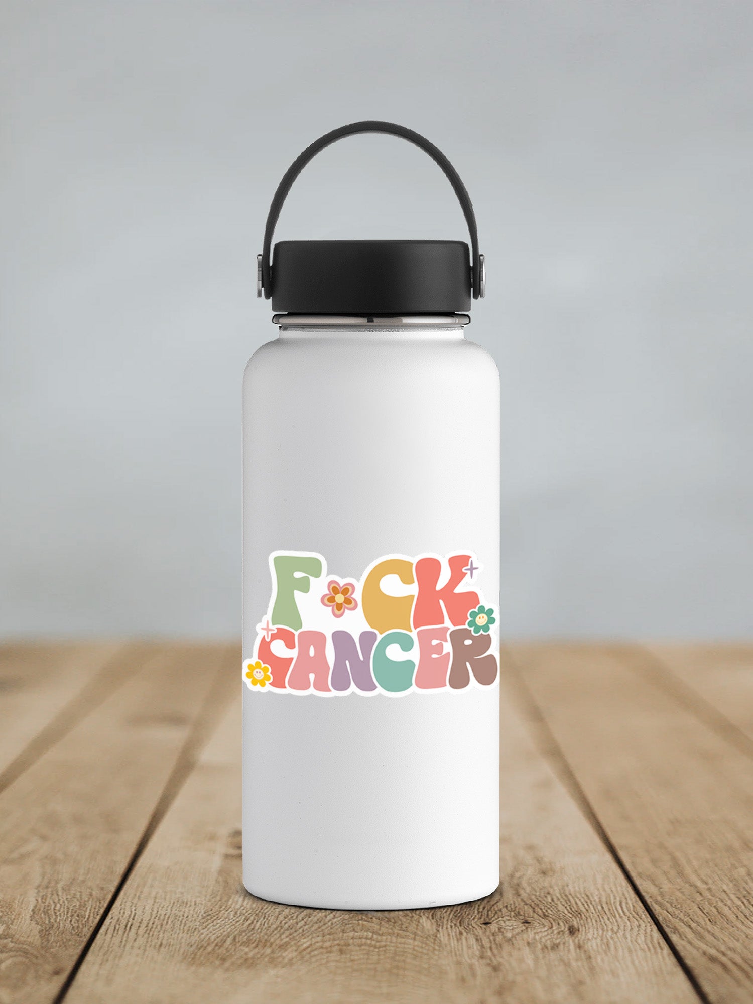 a white water bottle sitting on top of a wooden table